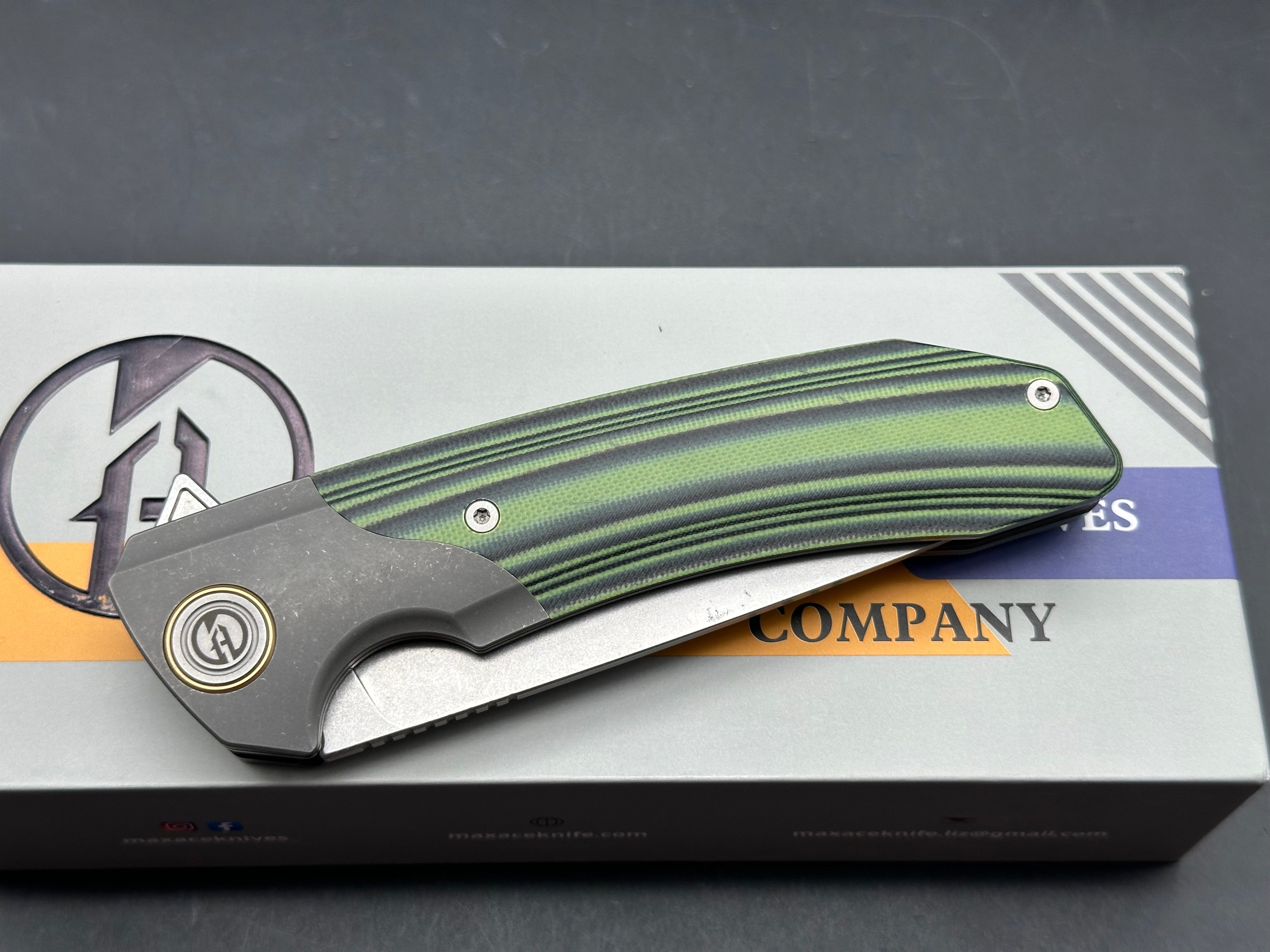 Maxace Goliath 2.0 Bohler K110 stainless blade. Green & Black G10 handle. Titanium bolsters
