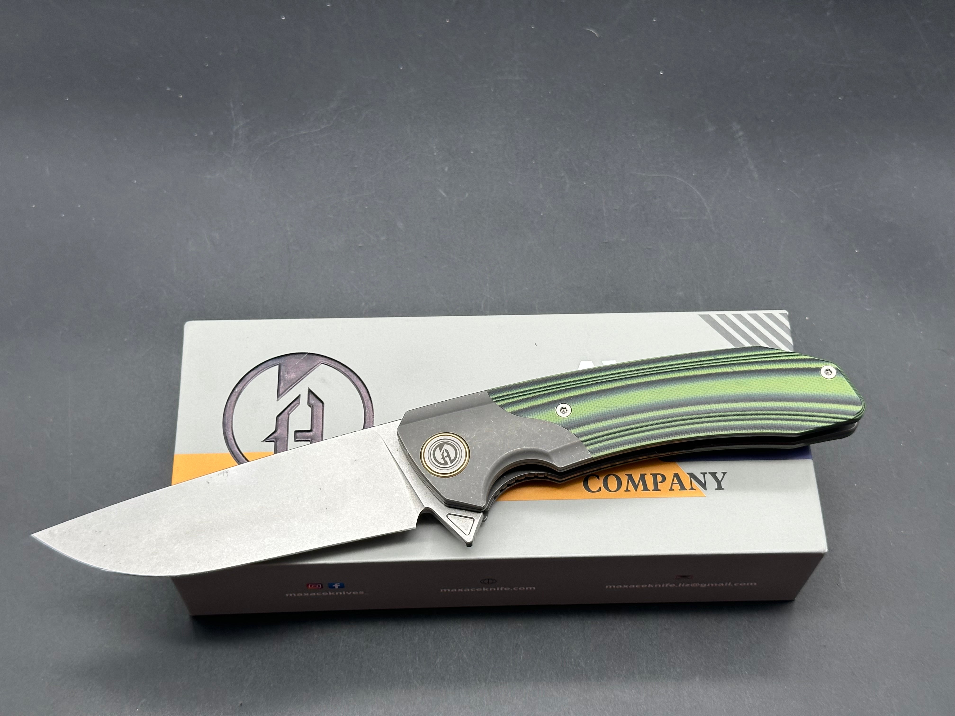 Maxace Goliath 2.0 Bohler K110 stainless blade. Green & Black G10 handle. Titanium bolsters