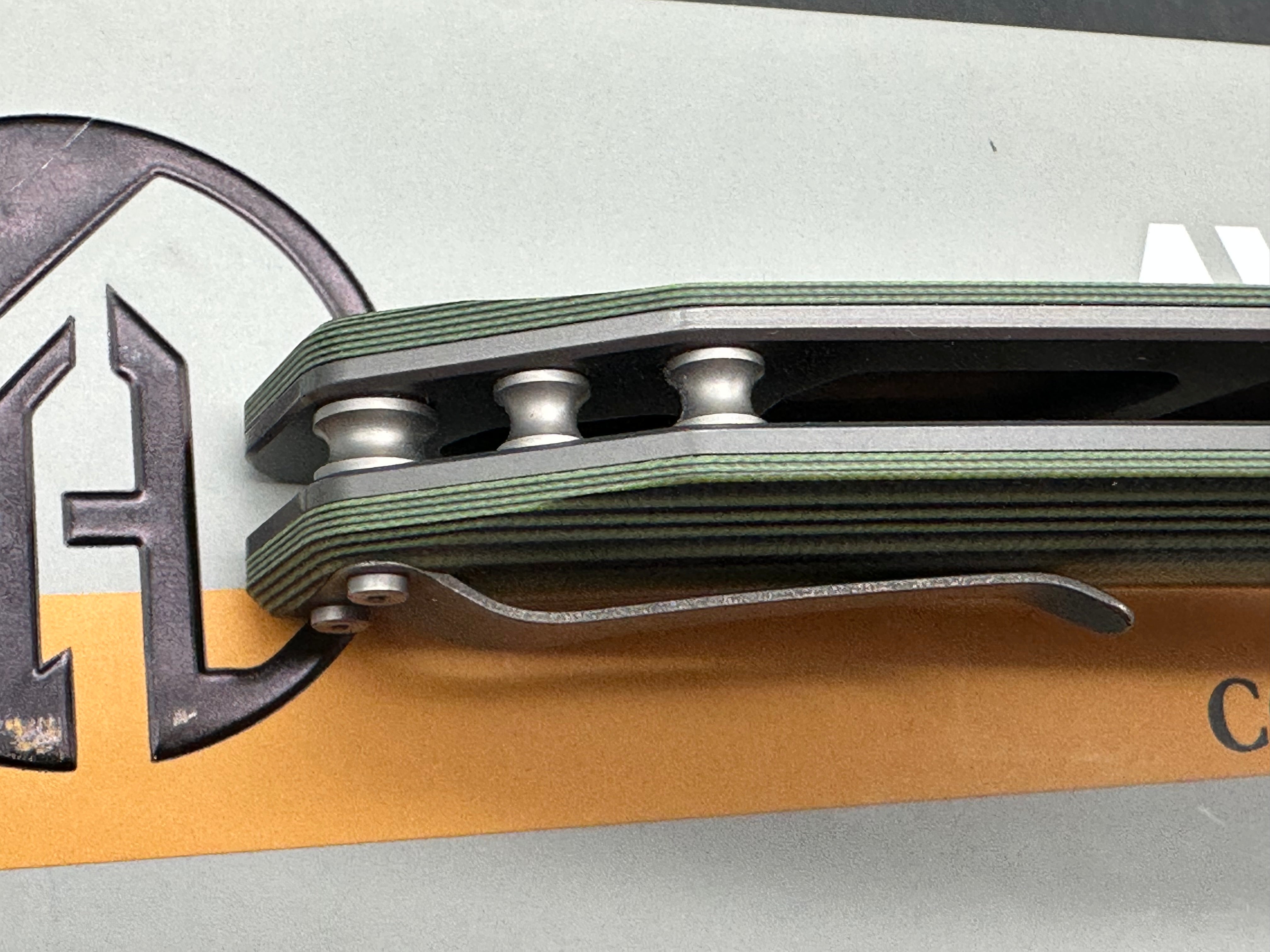 Maxace Goliath 2.0 Bohler K110 stainless blade. Green & Black G10 handle. Titanium bolsters