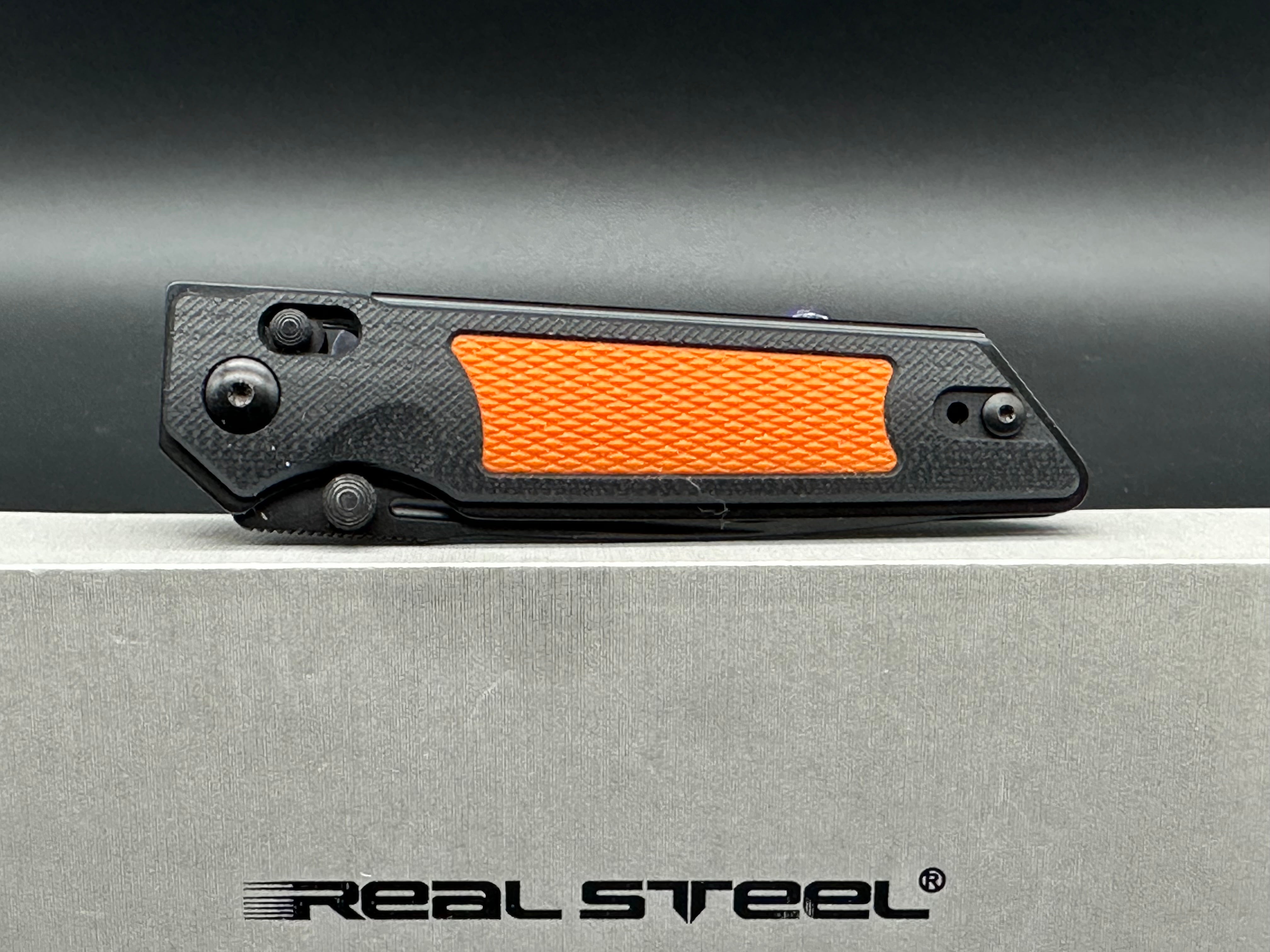 Real Steel Sacra TAC black/orange G10 scales w/black K120 blade