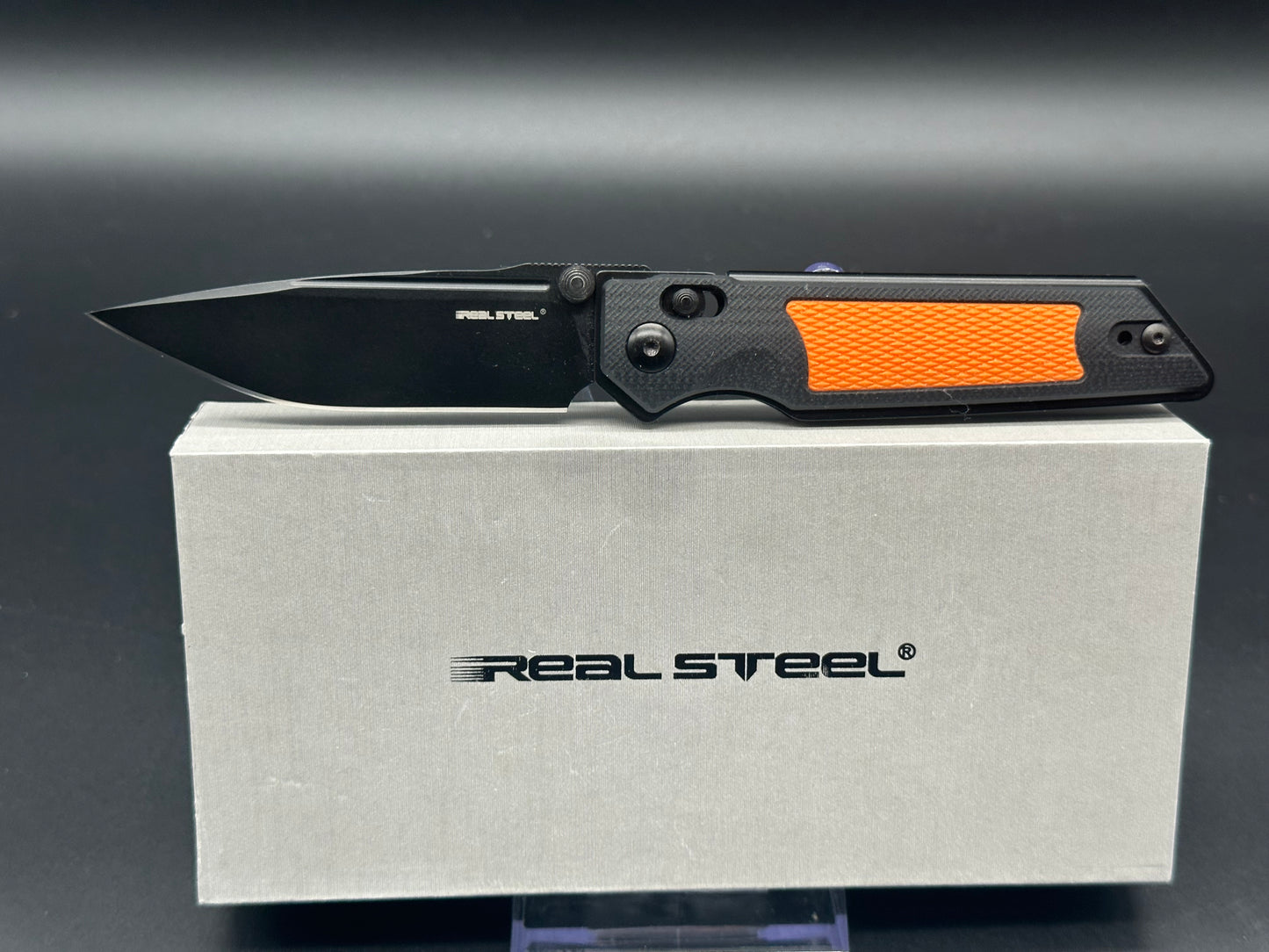 Real Steel Sacra TAC black/orange G10 scales w/black K120 blade