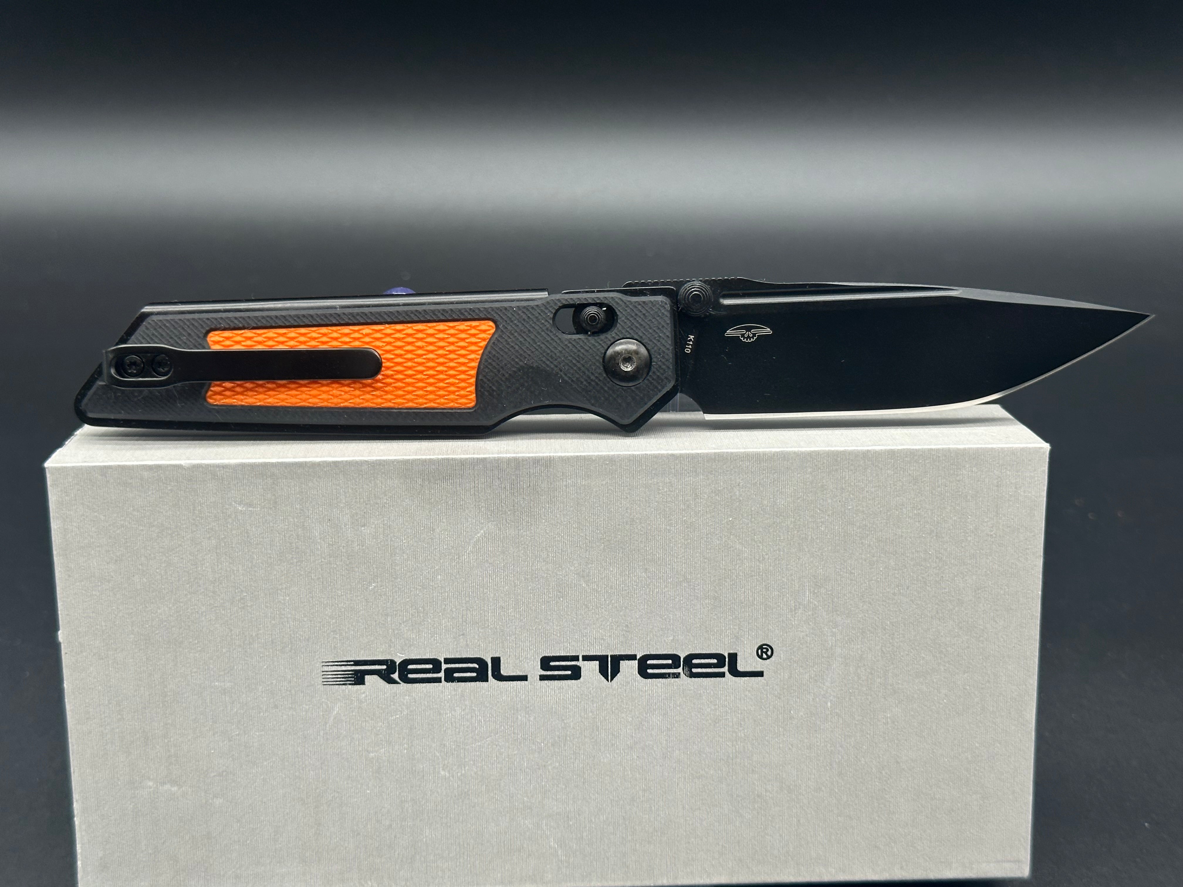 Real Steel Sacra TAC black/orange G10 scales w/black K120 blade