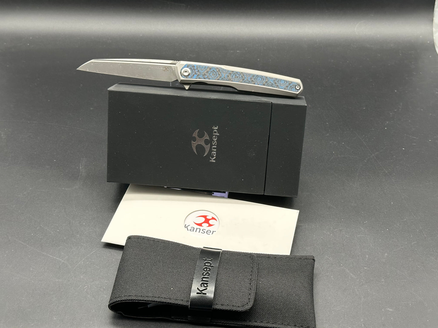 KANSEPT ARCUS FOLDING KNIFE BEAD BLAST TITANIUM/BLUE ROSE PATTERN CARBON FIBER HANDLE DAMASCUS PLAIN