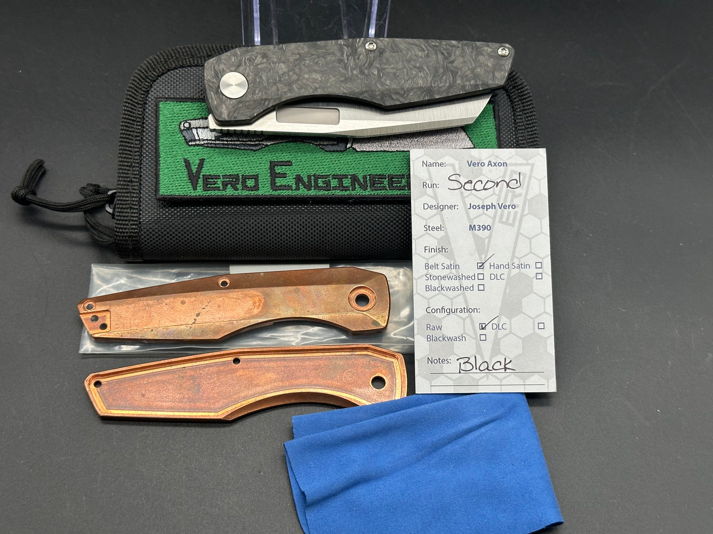 Vero Axon belt satin, carbon fiber scales, and extra cooper scales