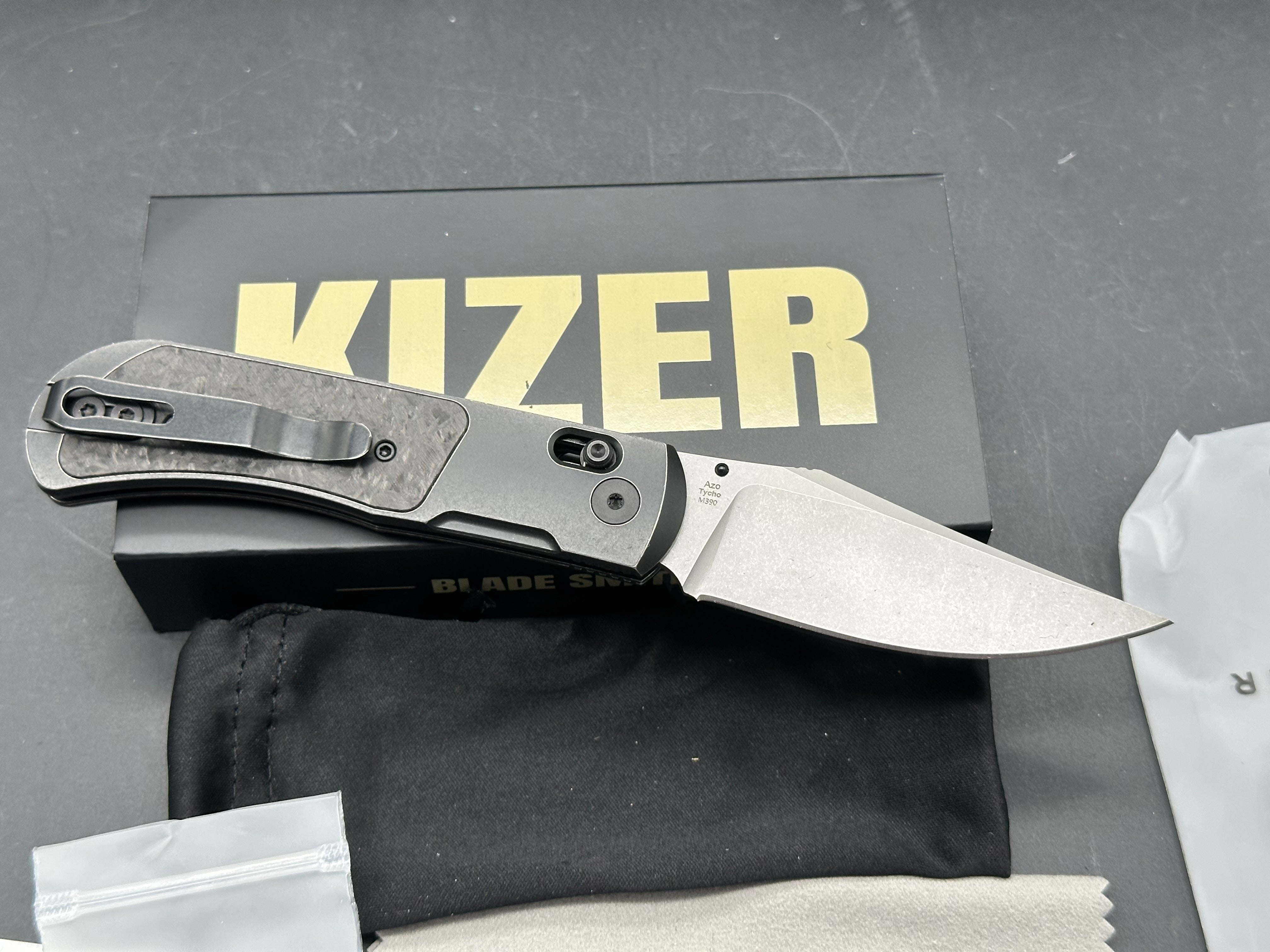 KIZER TYCHO FOLDING KNIFE TITANIUM/CARBON FIBER HANDLE M390 CLIP POINT PLAIN EDGE STONEWASH FINISH