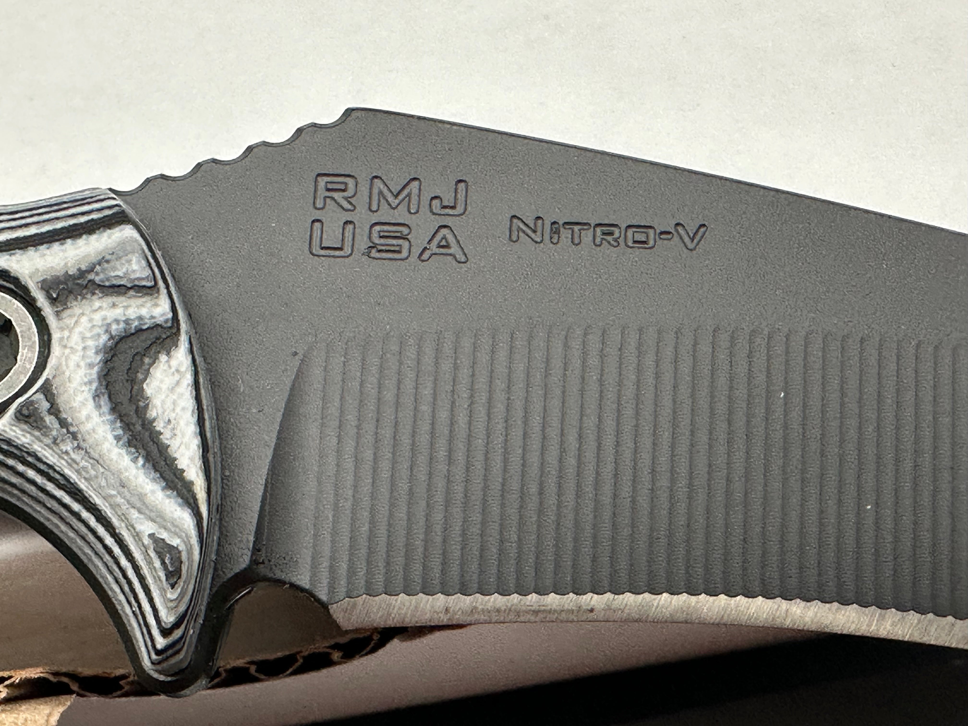 RMJ Tactical Peregrine DLT Exclusive with Urban Camo handles. Black Nitro-V blade