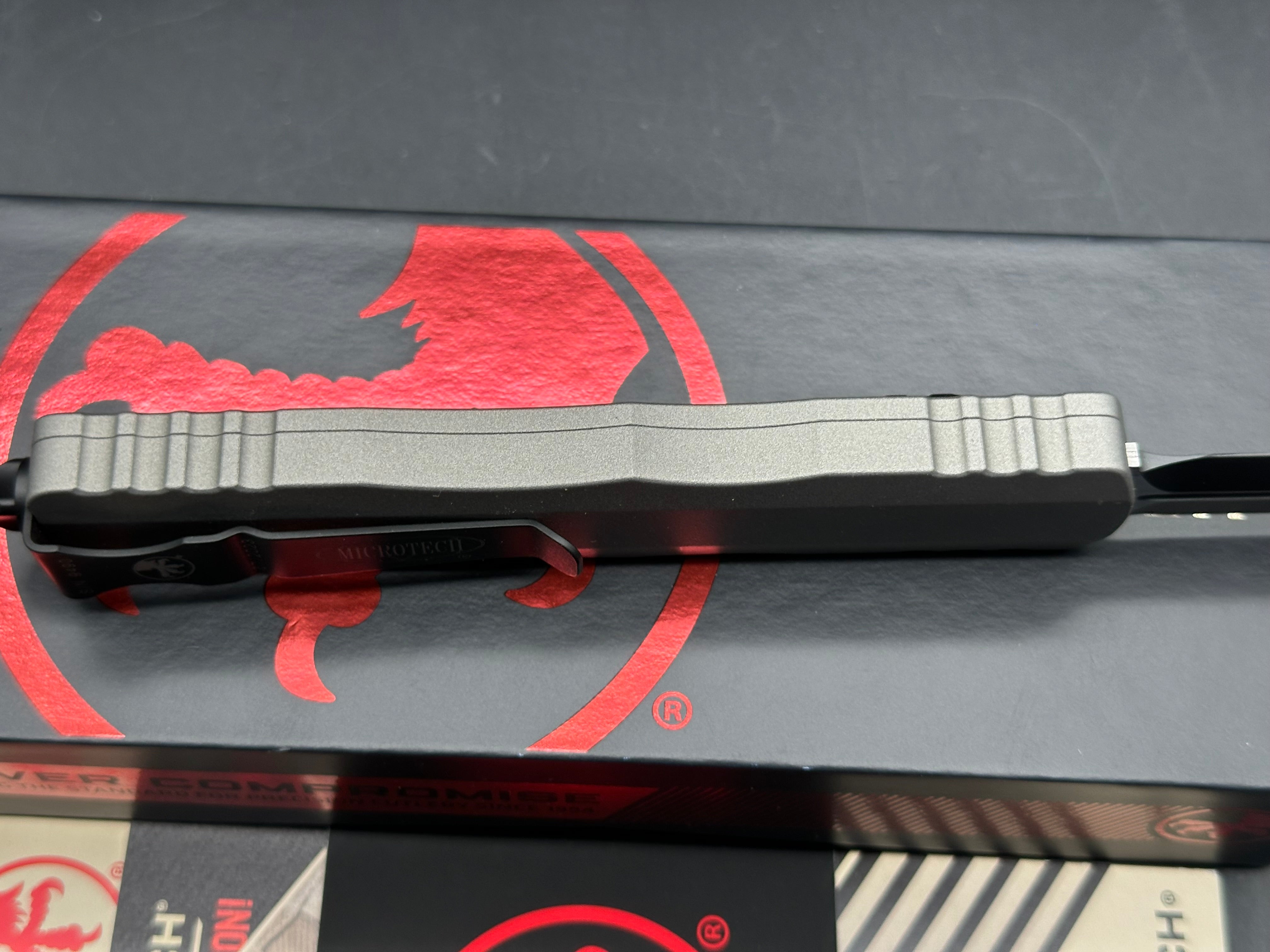 Microtech 227-1TG Dirac Delta AUTO OTF Knife 3.79" Black Double Edge Dagger Blade, Titanium Gray Aluminum Handles