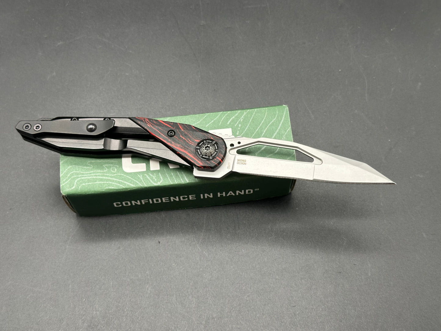 CRKT + Princeton Wong Design - Nucleus/Black Stainless Steel Frame Red Gmasacus G10 Bolster 12C27 blade