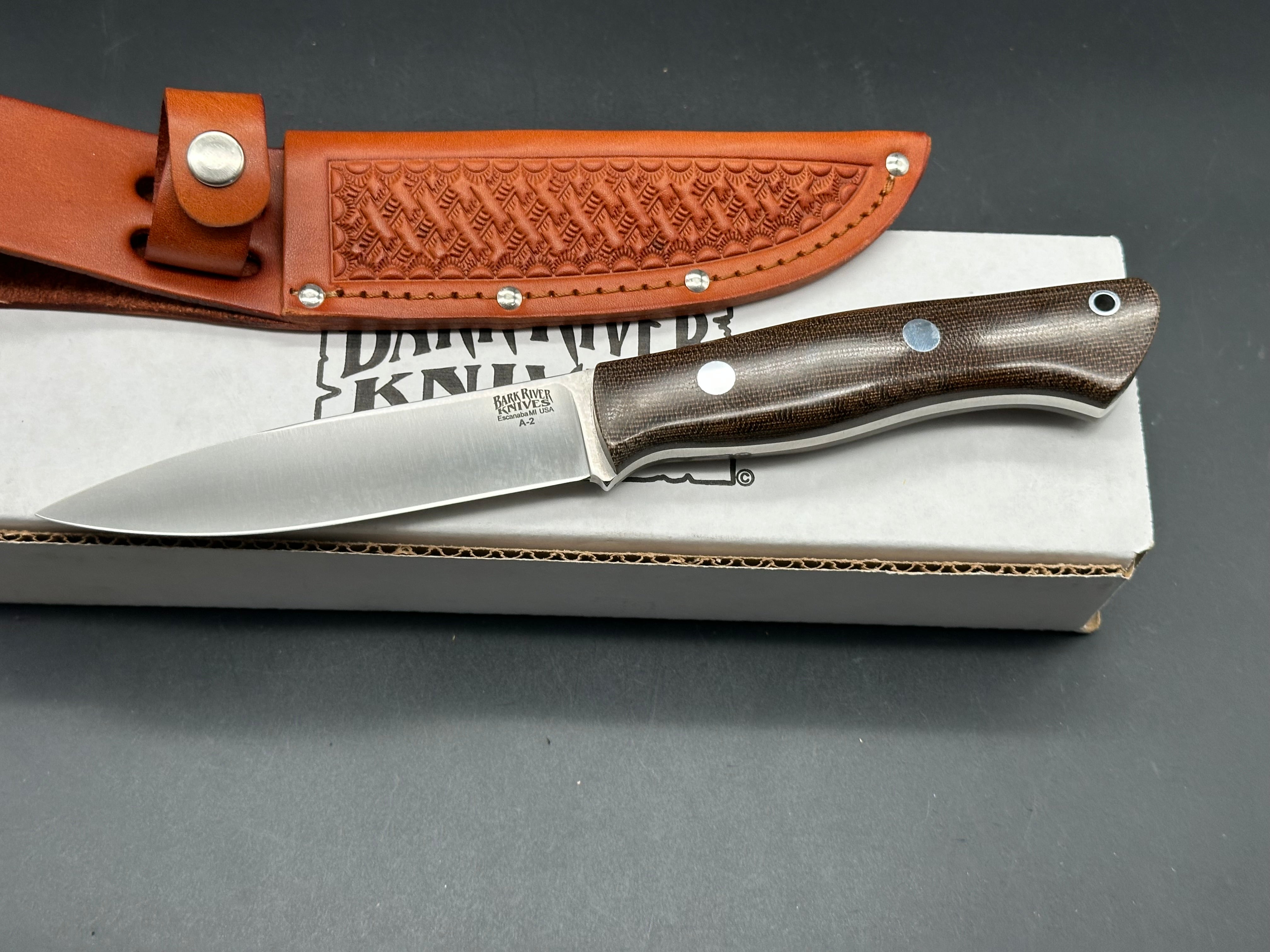 Bark River Aurora green canvas micarta scales, A-2 tool steel blade, brown leather sheath