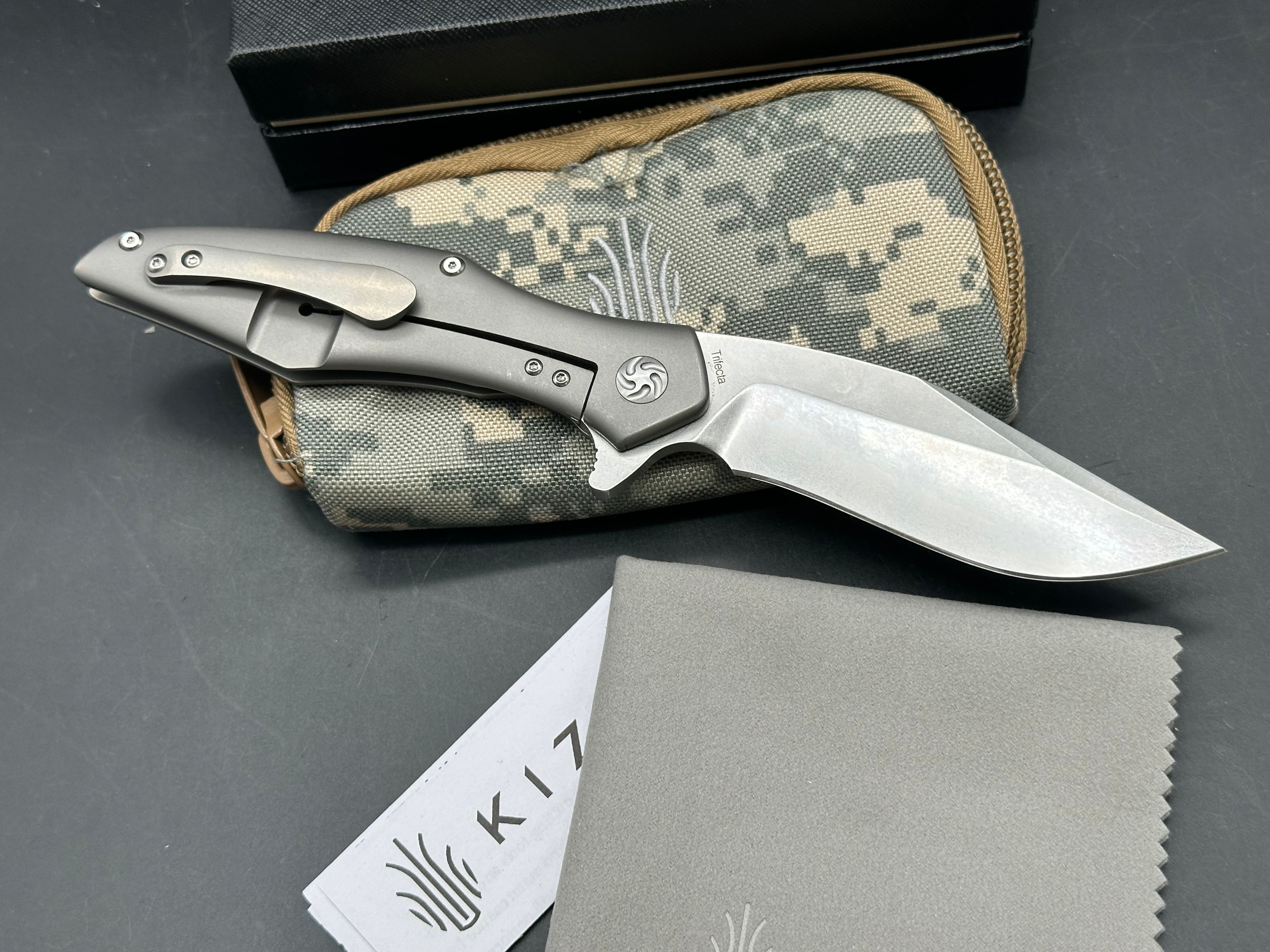 Kizer Trifecta: Matt Cuchiara design. 3.875 stonewash, drop point, hollow grind CPM-S35VN blade. Titanium handle with milled titanium clip