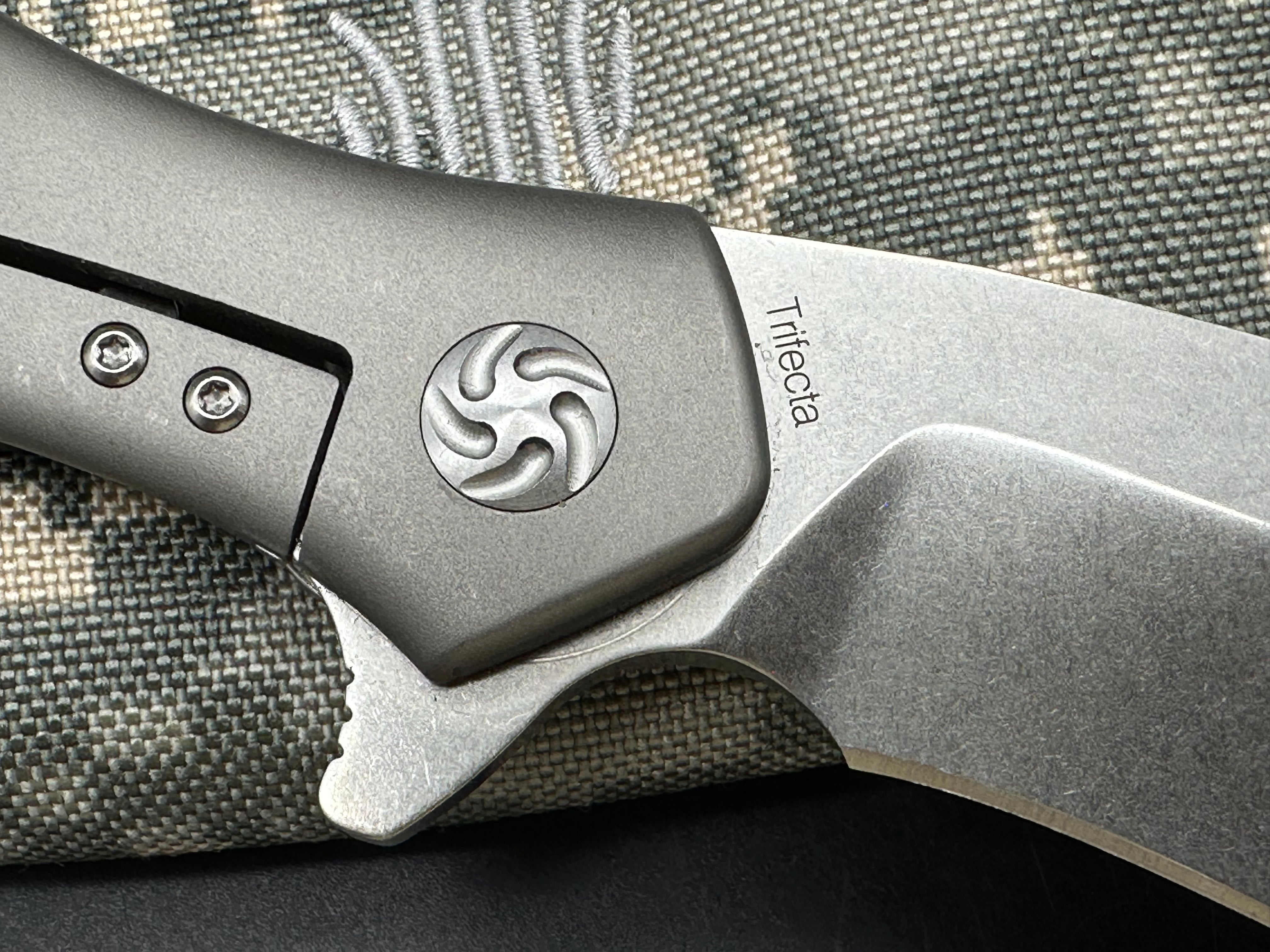 Kizer Trifecta: Matt Cuchiara design. 3.875 stonewash, drop point, hollow grind CPM-S35VN blade. Titanium handle with milled titanium clip