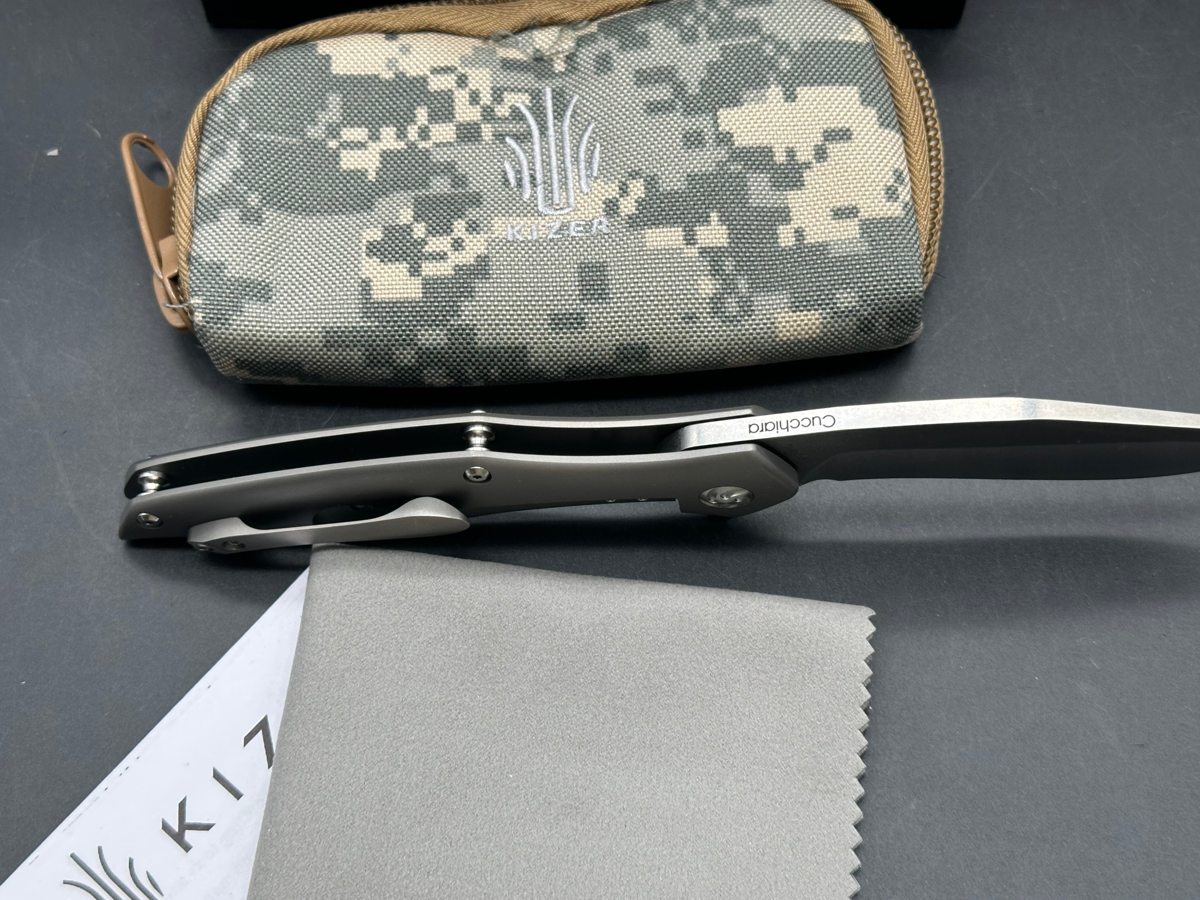 Kizer Trifecta: Matt Cuchiara design. 3.875 stonewash, drop point, hollow grind CPM-S35VN blade. Titanium handle with milled titanium clip