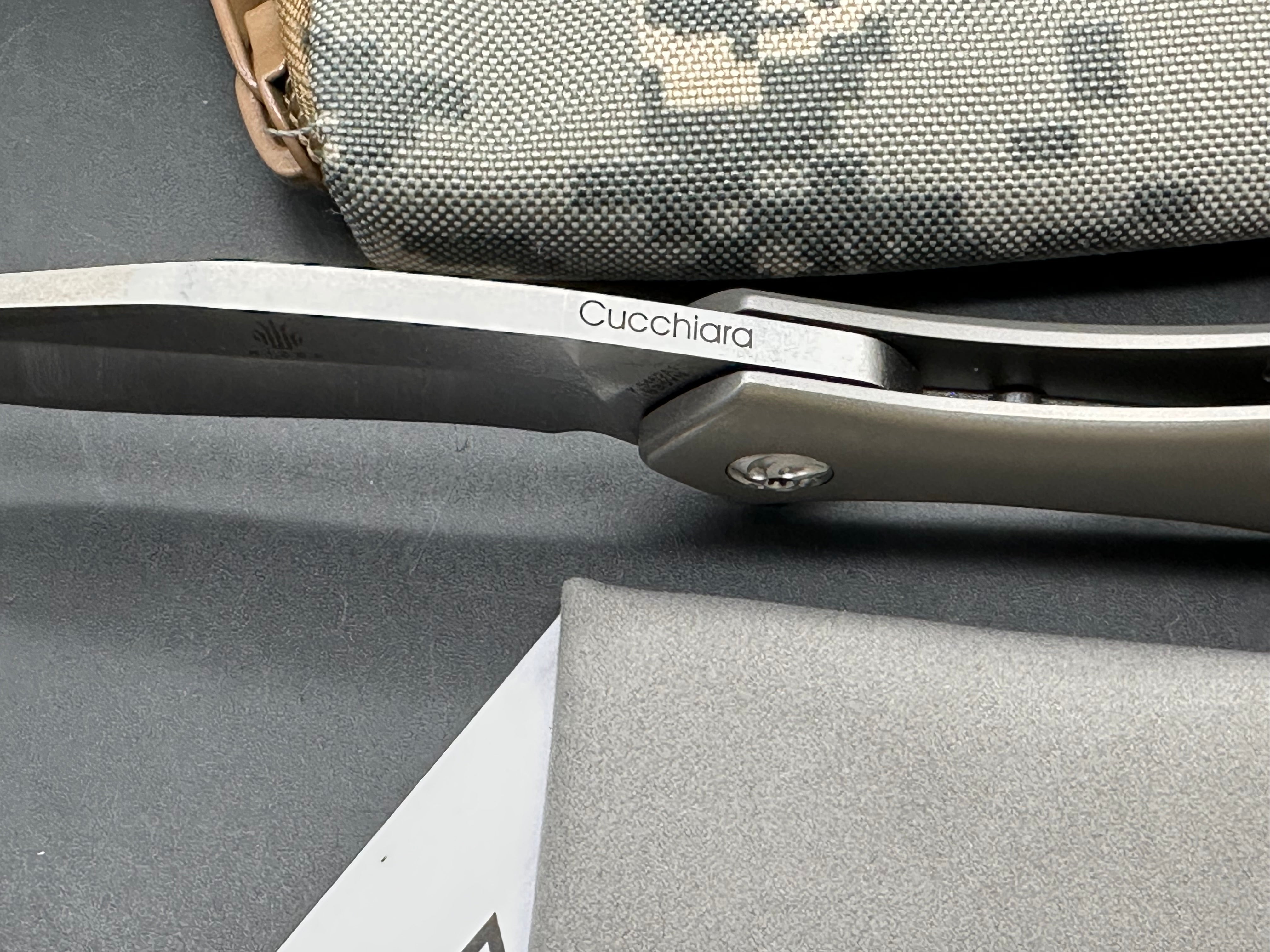 Kizer Trifecta: Matt Cuchiara design. 3.875 stonewash, drop point, hollow grind CPM-S35VN blade. Titanium handle with milled titanium clip