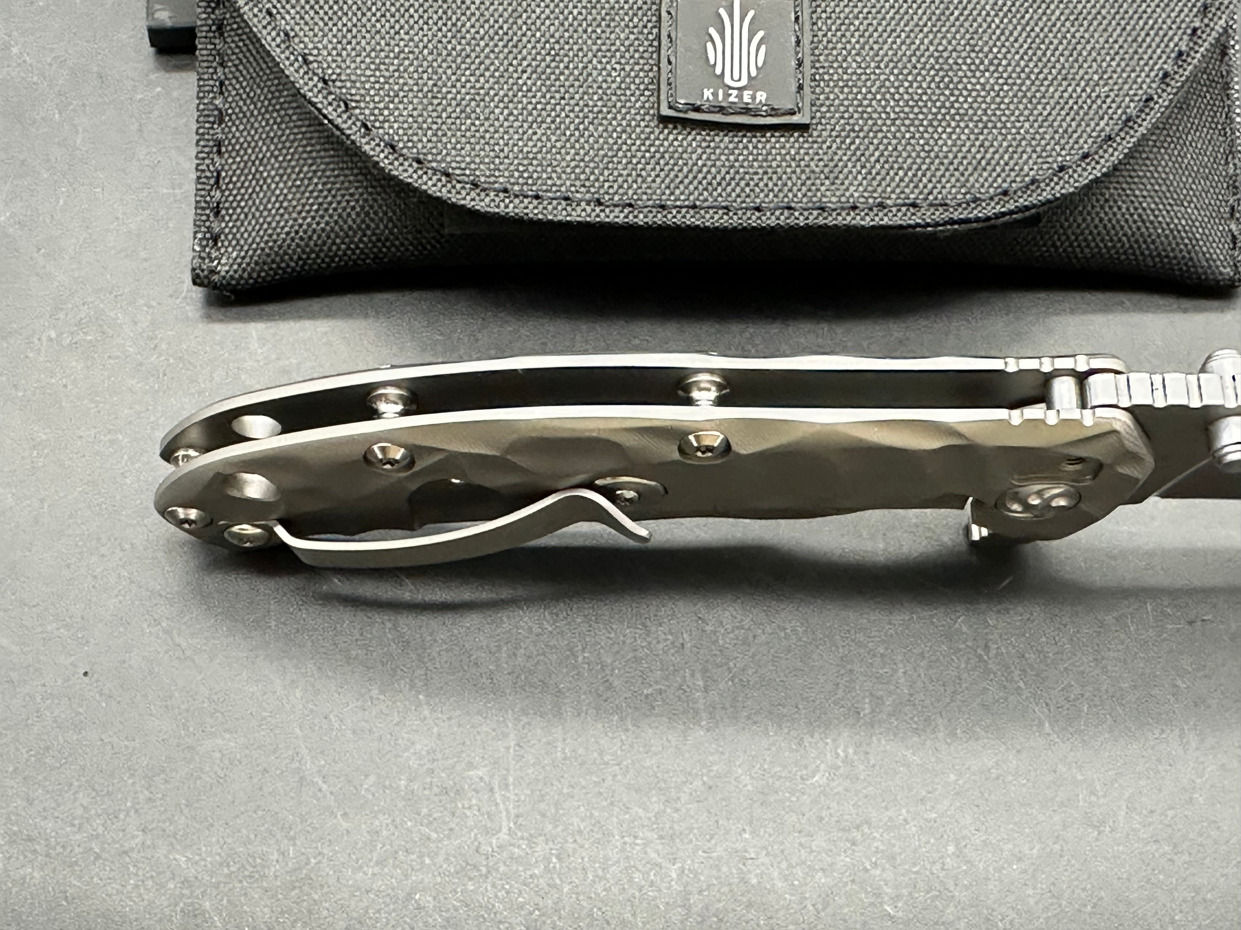 Kizer Caligine 3.58 inch stonewash, drop point, flat grind CPM-S35VN blade. Frame lock. Titanium handle. Titanium clip