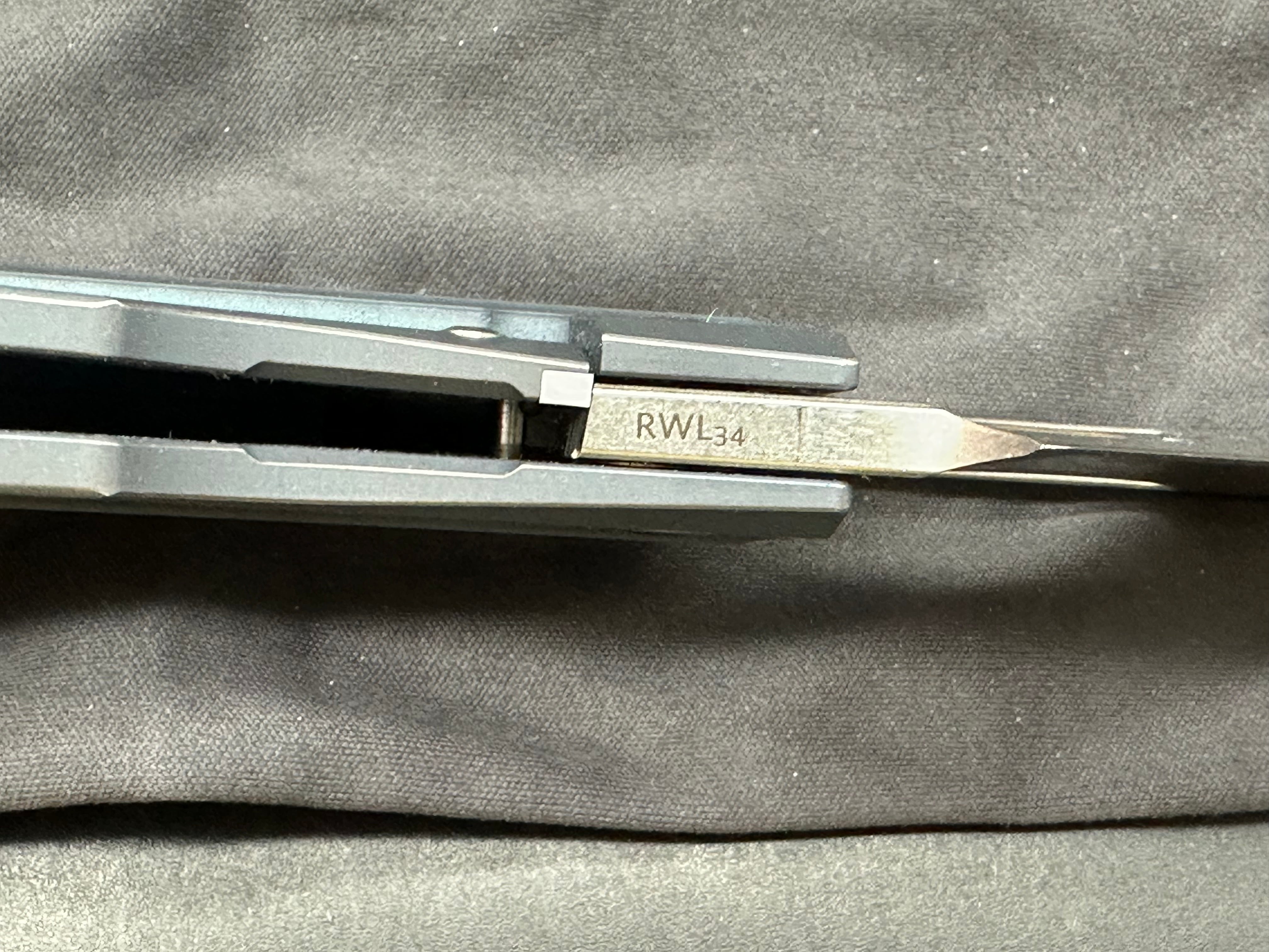 Reate Baby Machine: Tashi Bharucha design. 3.25 inch freeze edged, satin, sheepsfoot, clip point RWL-34 blade