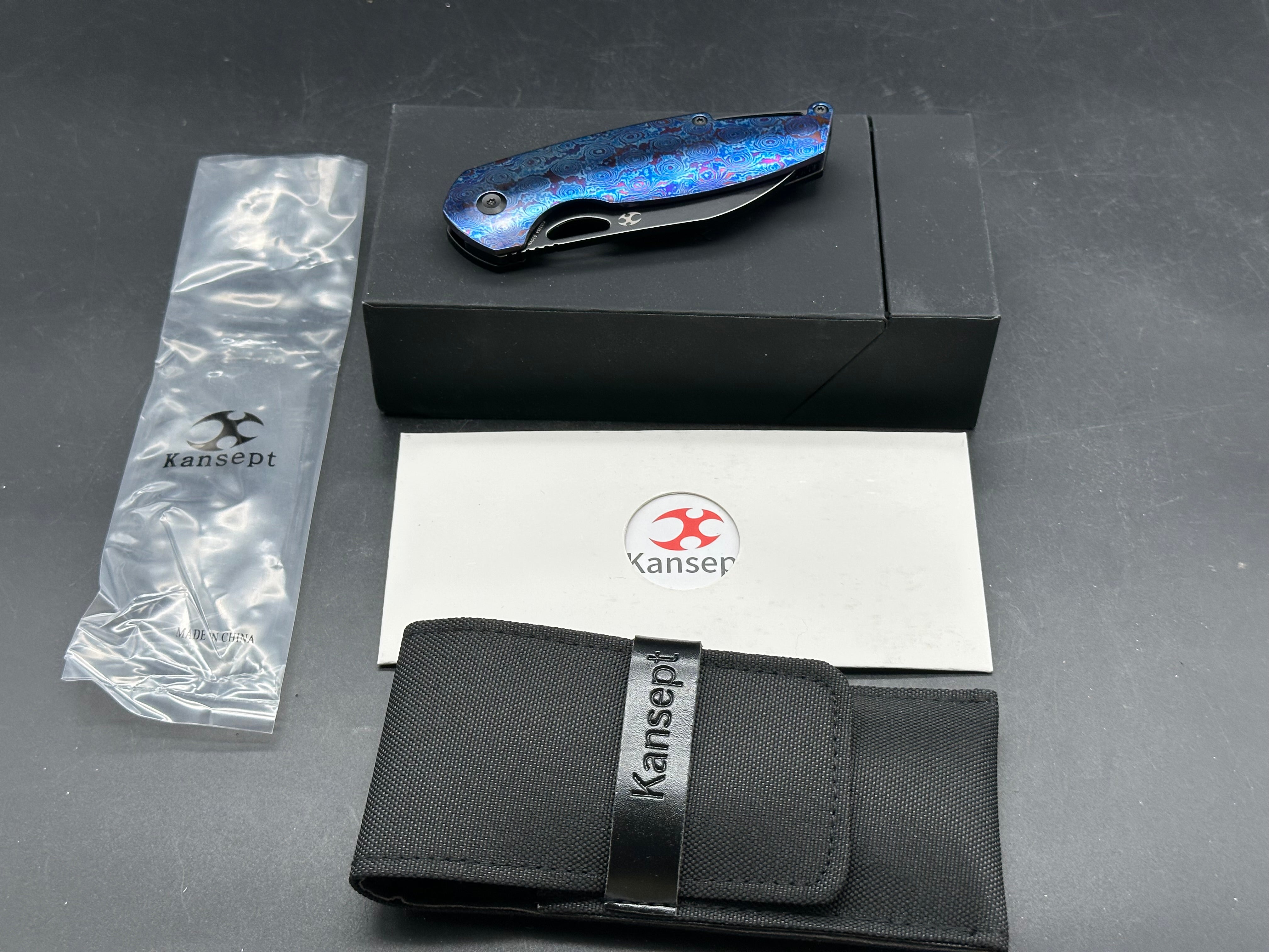 Kansept Model 6: Nick Swan design. 3.1 inch stonewashed, flat grind, black anodized CPM-S35VN sheepsfoot blade