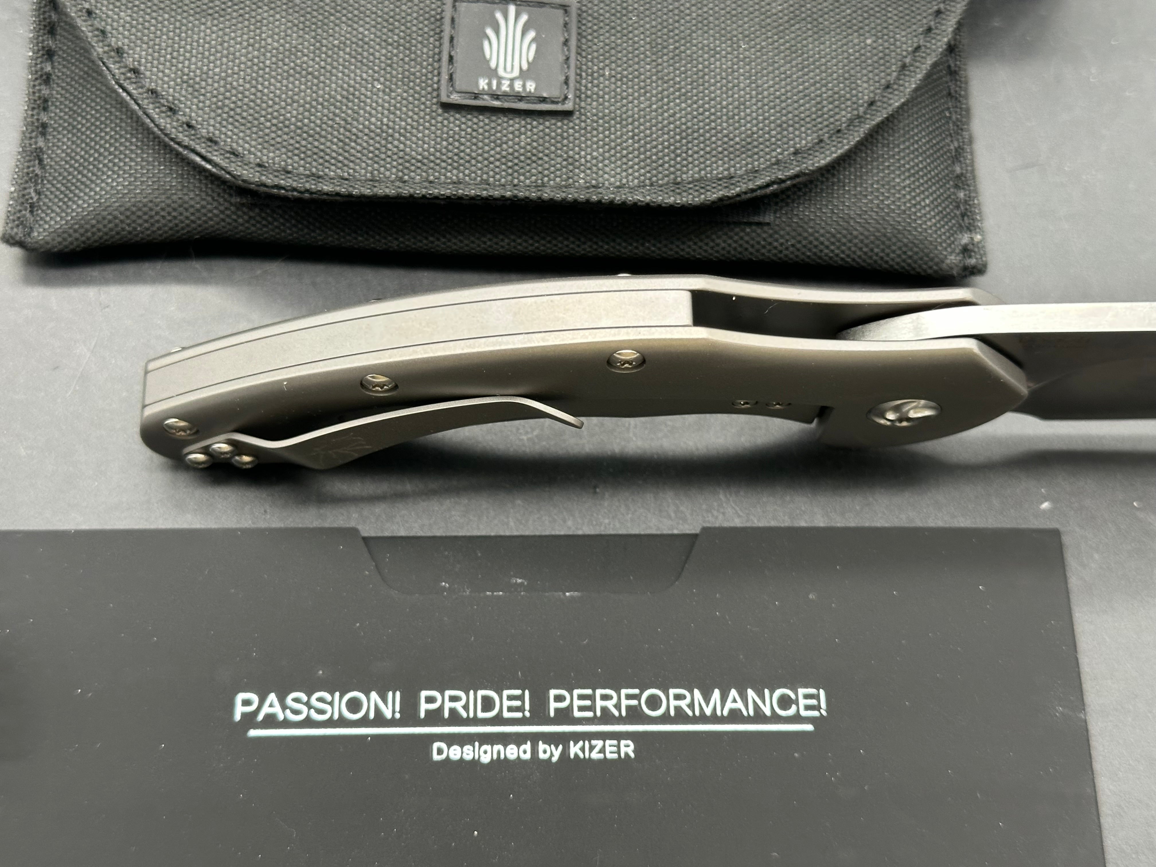 Kizer Roach Matt Degnan design 3.5 inch drop point flat grind, satin CPM-S35VN blade Titanium scales and clip with Roach insignia