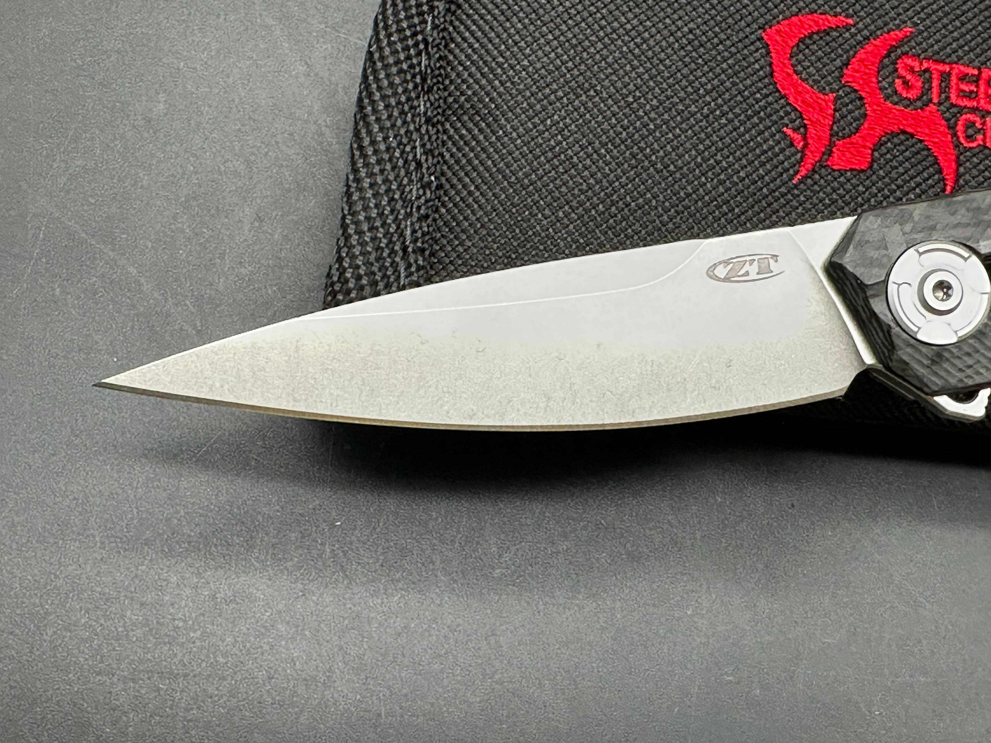 Zero Tolerance ZT 0707: 3.625 inch tumbled, drop point CPM-20CV blade. Titanium handle