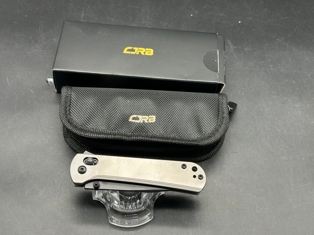 CJRB Bolt Titanium handle w/ black AR-RPM9 blade