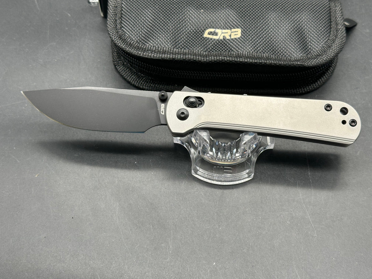 CJRB Bolt Titanium handle w/ black AR-RPM9 blade