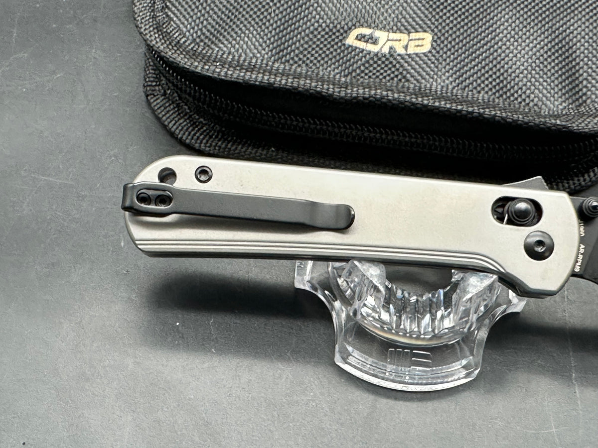 CJRB Bolt Titanium handle w/ black AR-RPM9 blade