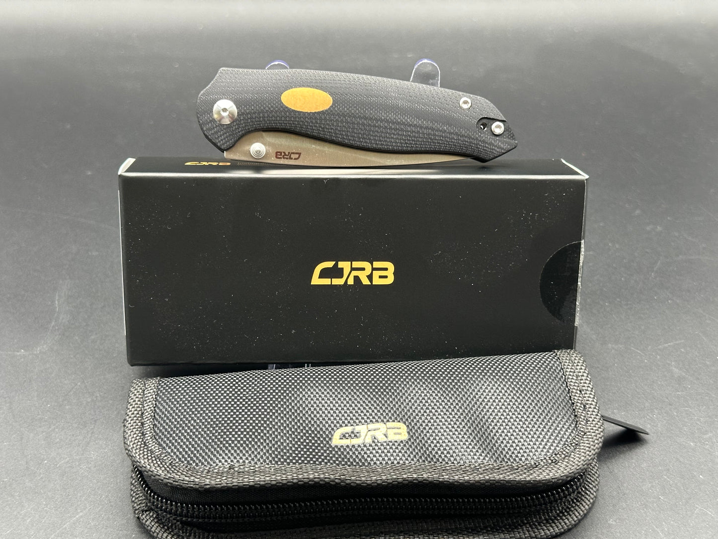 CJRB AES BLACK G10/BRASS HANDLE AR-RPM9 DROP POINT PLAIN EDGE SAND POLISH FINISH