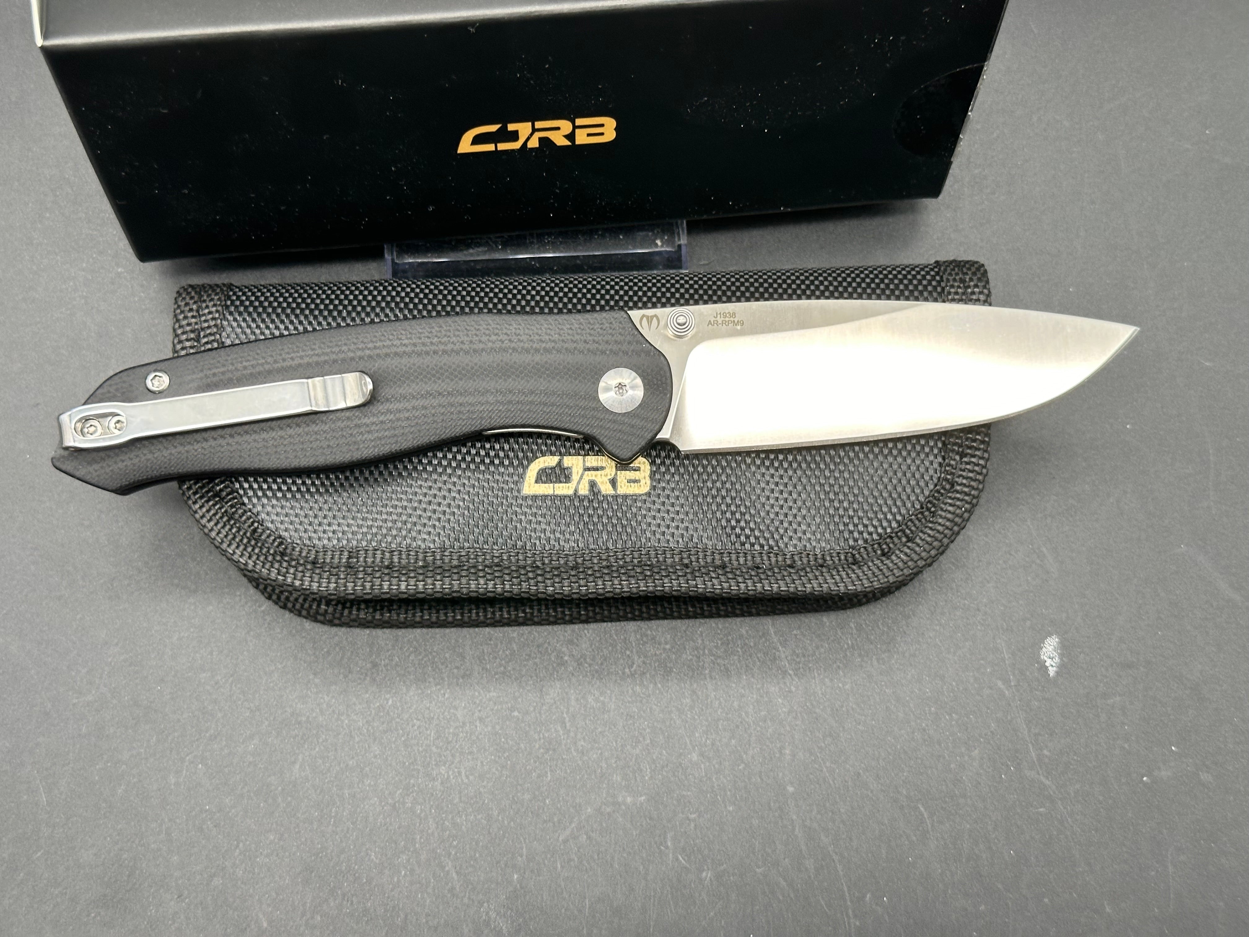 CJRB AES BLACK G10/BRASS HANDLE AR-RPM9 DROP POINT PLAIN EDGE SAND POLISH FINISH