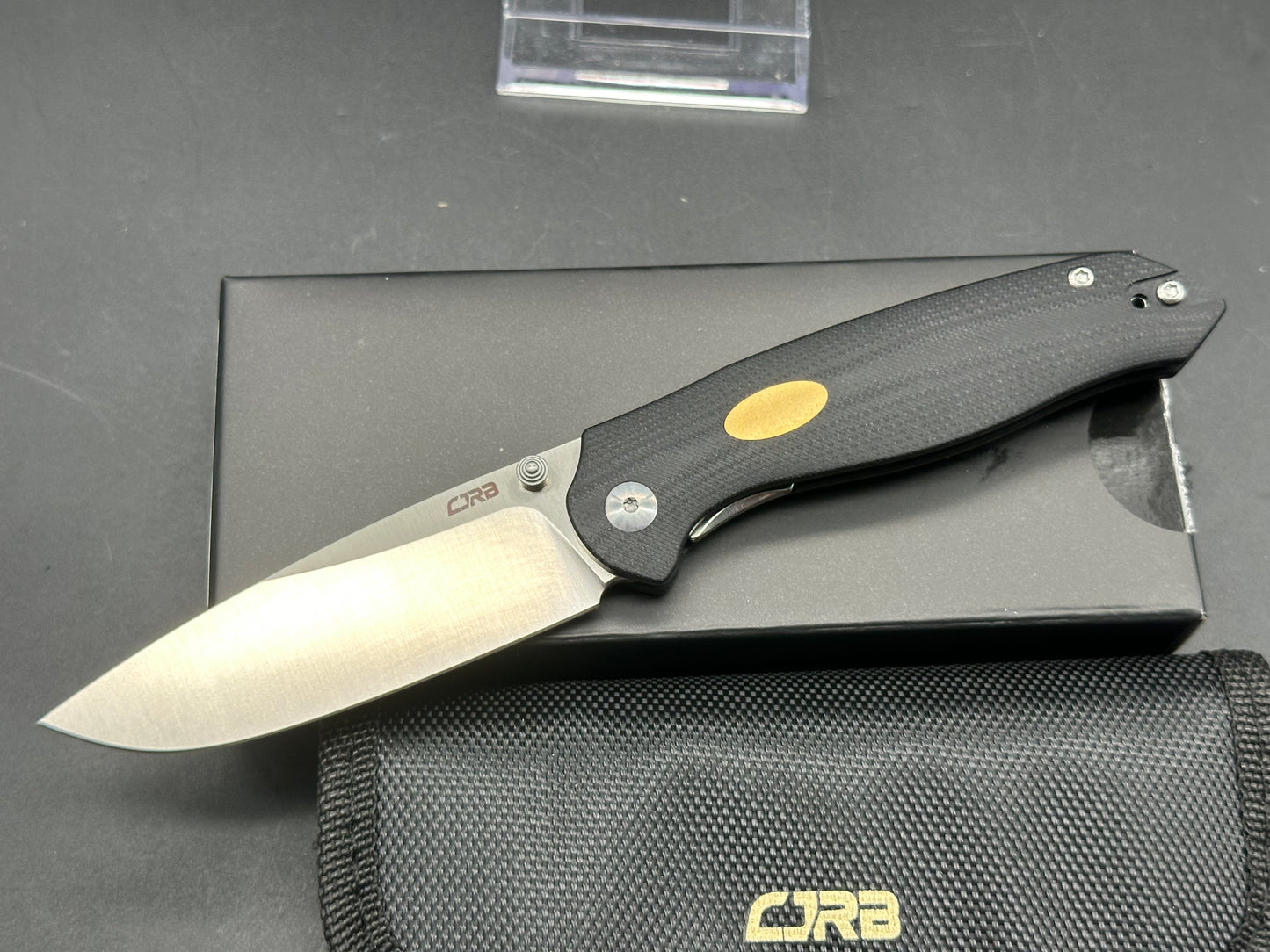 CJRB AES BLACK G10/BRASS HANDLE AR-RPM9 DROP POINT PLAIN EDGE SAND POLISH FINISH