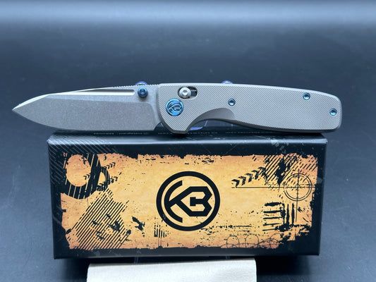 Kubey Bluff S35VN Drop Point Blade with Textured Titanium Handle