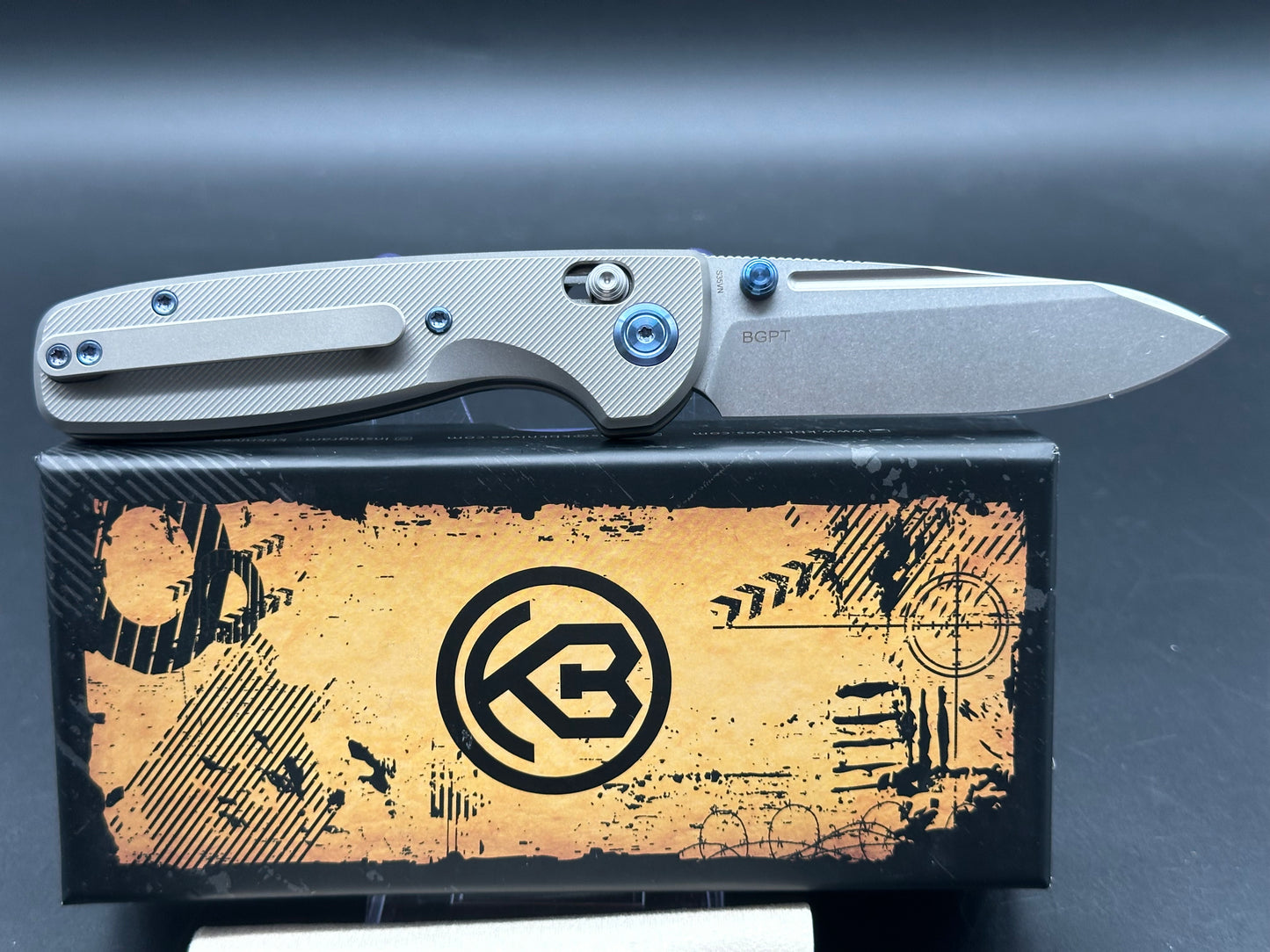 Kubey Bluff S35VN Drop Point Blade with Textured Titanium Handle