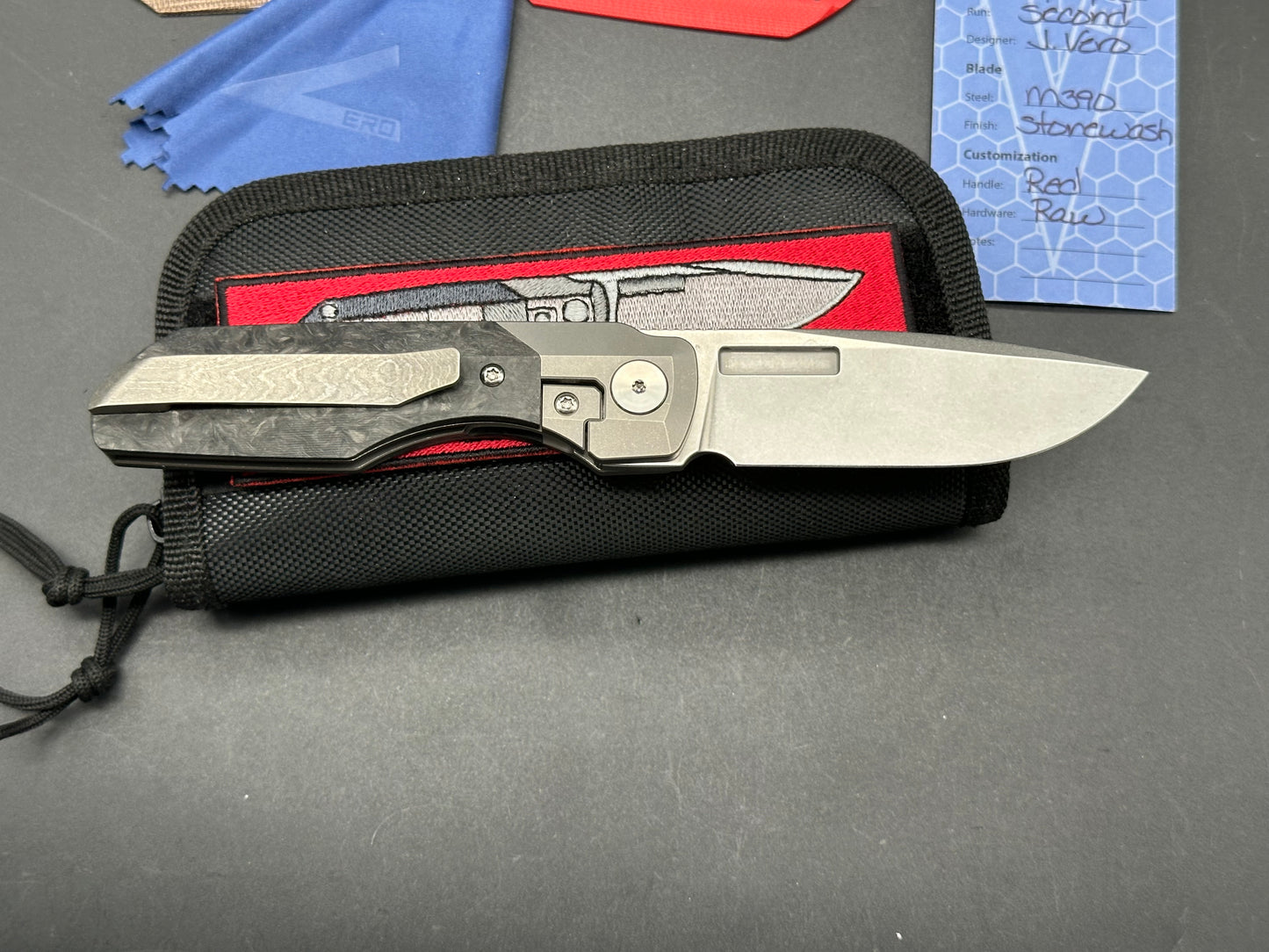 Vero Engineering Synapse Gen 2, Stonewashed 3.2 inch M390 blade, Marbled Carbon fiber scales plus 2 more, Zircuti clip and backspacer