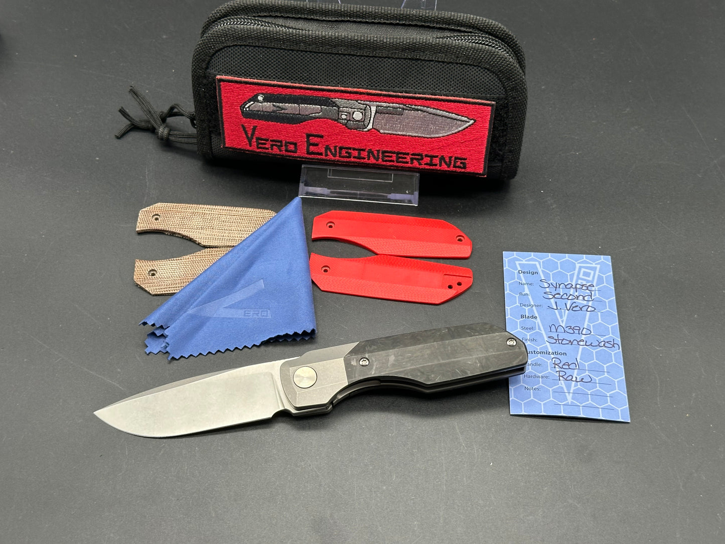 Vero Engineering Synapse Gen 2, Stonewashed 3.2 inch M390 blade, Marbled Carbon fiber scales plus 2 more, Zircuti clip and backspacer