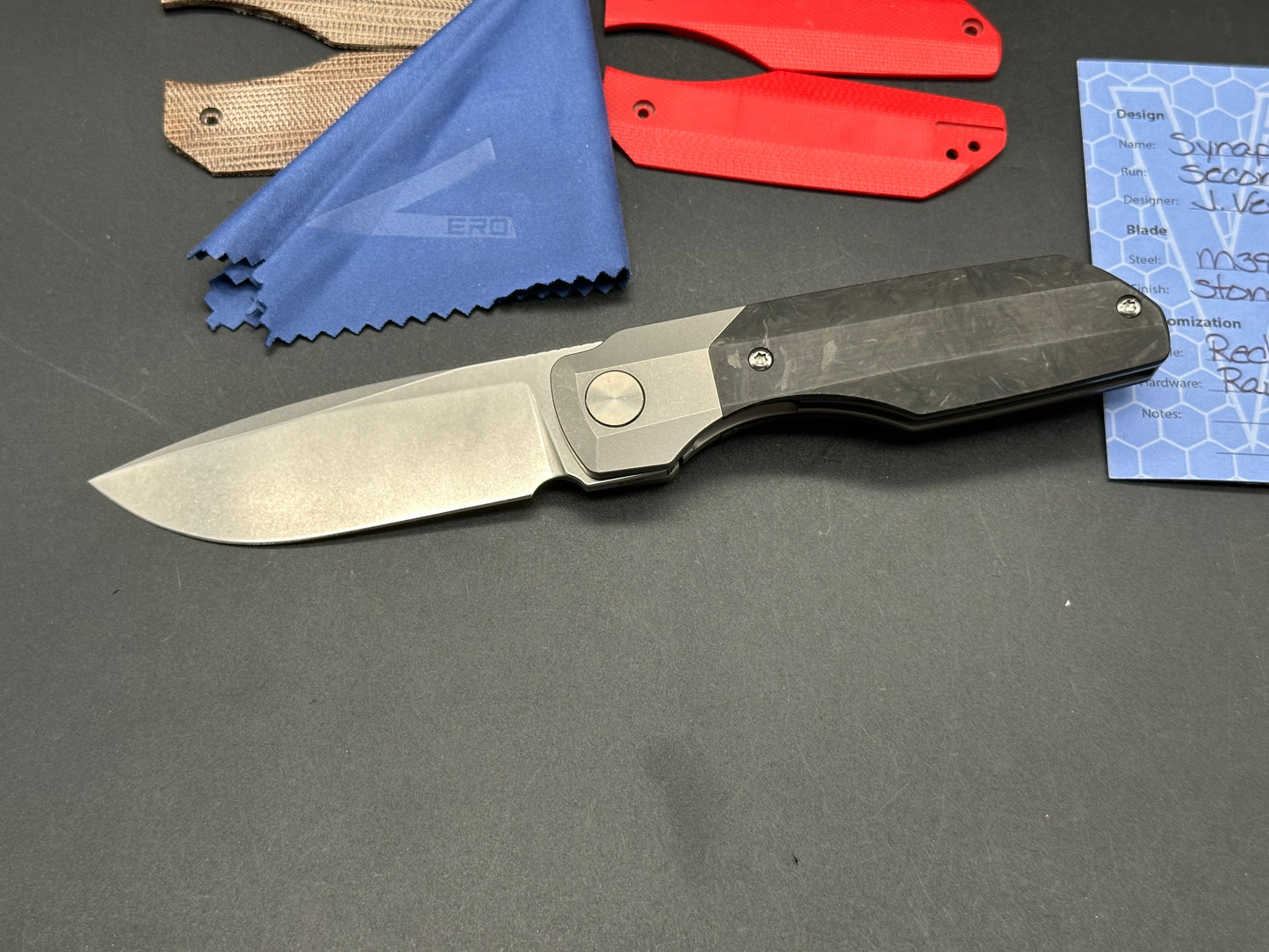 Vero Engineering Synapse Gen 2, Stonewashed 3.2 inch M390 blade, Marbled Carbon fiber scales plus 2 more, Zircuti clip and backspacer