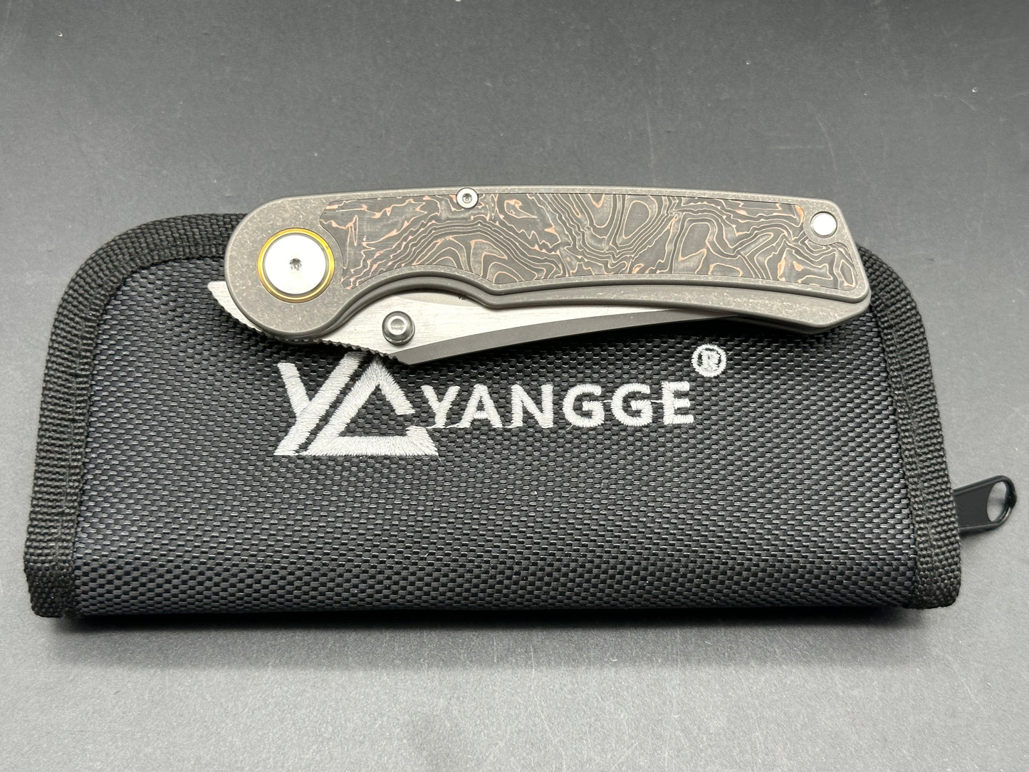 YANGGE FOLDING KNIFE SANDWASHED TITANIUM COPPER FOIL CARBON FIBER HANDLE S90V