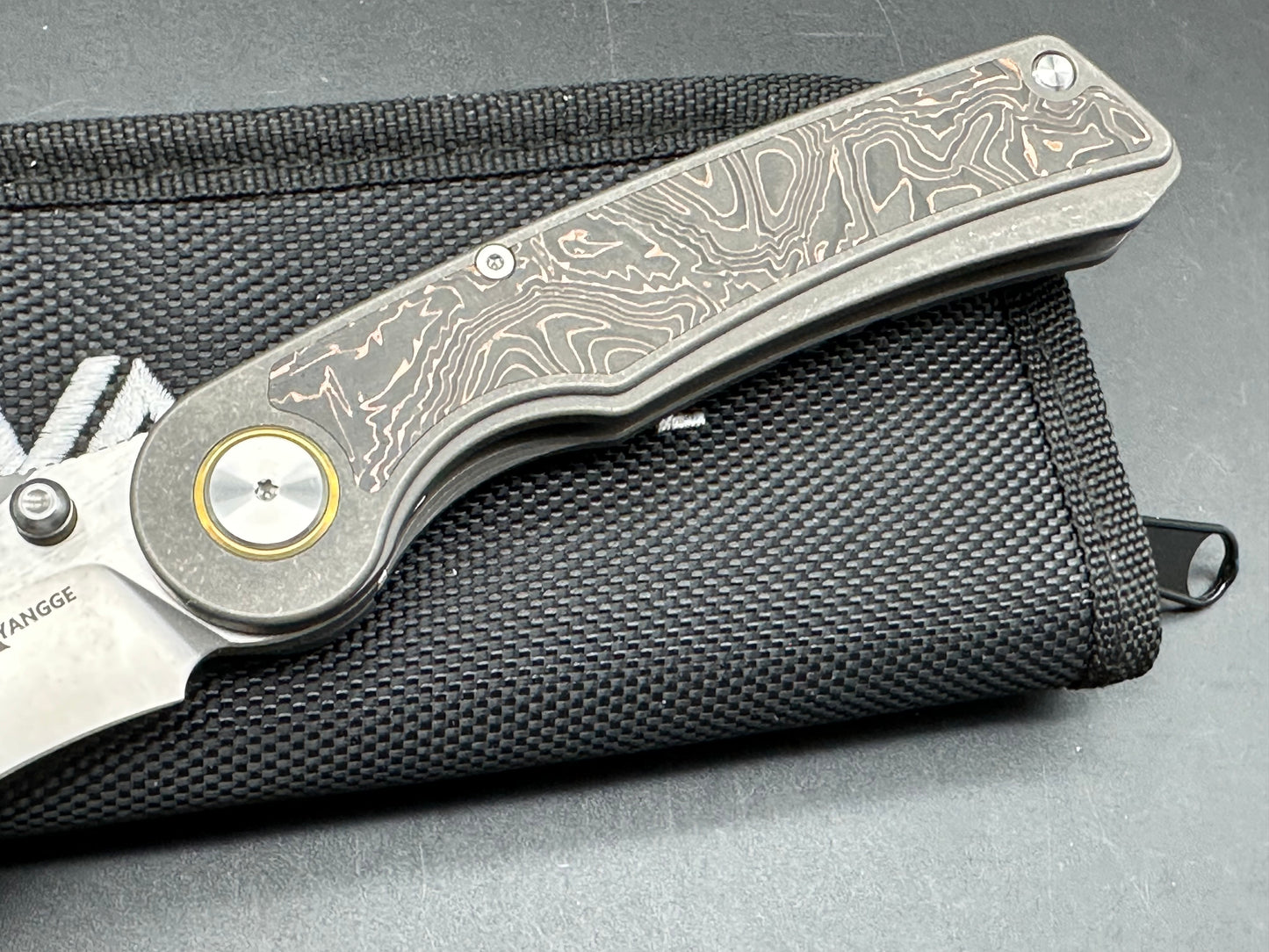 YANGGE FOLDING KNIFE SANDWASHED TITANIUM COPPER FOIL CARBON FIBER HANDLE S90V