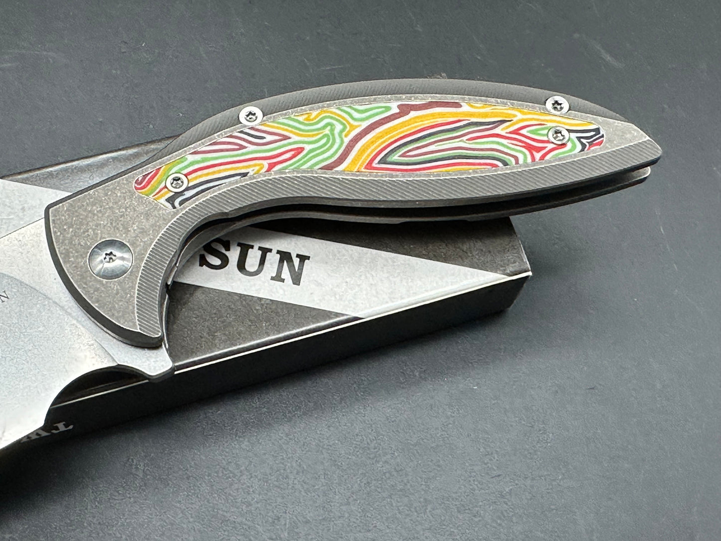 TWO SUN FOLDING KNIFE TITANIUM & MULTI-COLOR G10 HANDLE 14C28N PLAIN EDGE STONEWASH FINISH TS465