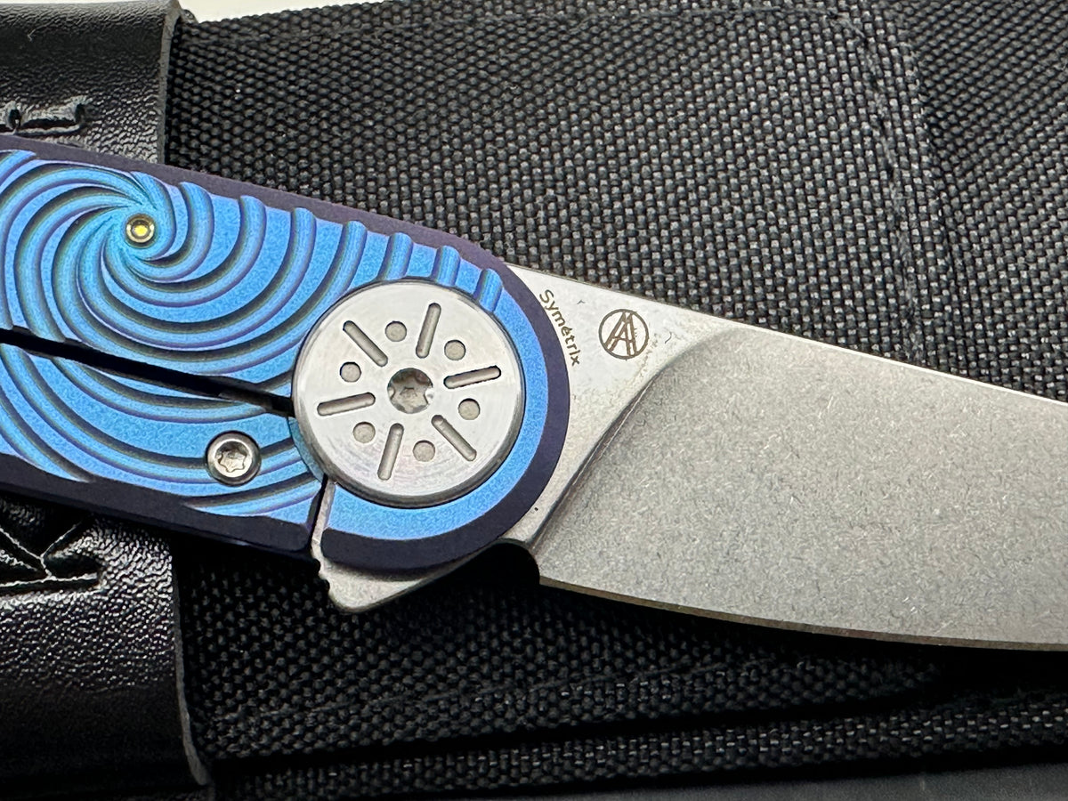 KANSEPT SYMÉTRIX BLUE-PURPLE ANODIZED TITANIUM/SWIRL PATTERN HANDLE 2.85" STONEWASH S35VN