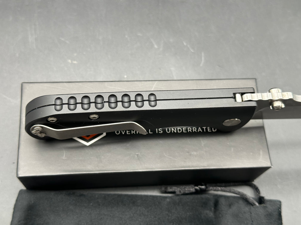 Defiant 7 | Les George Design - Talos, 3.5" MagnaCut Stonewash Drop Point Blade with Black Harden Anodized 6061 Aluminum Scales