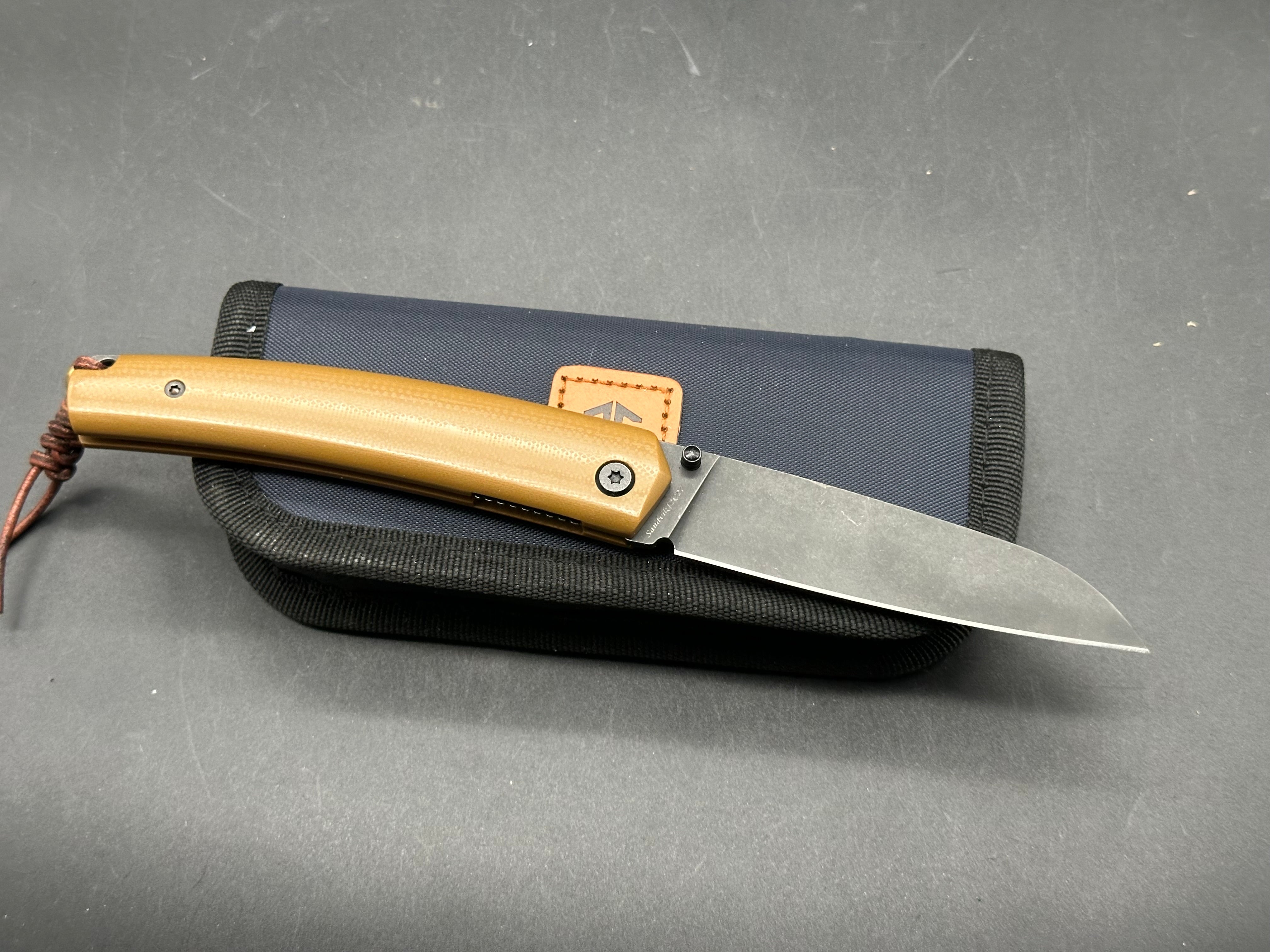Petrified Fish Patte,3.43" 12C27N Blade,Wood/G10 Handle,Thumb Stud Liner Lock