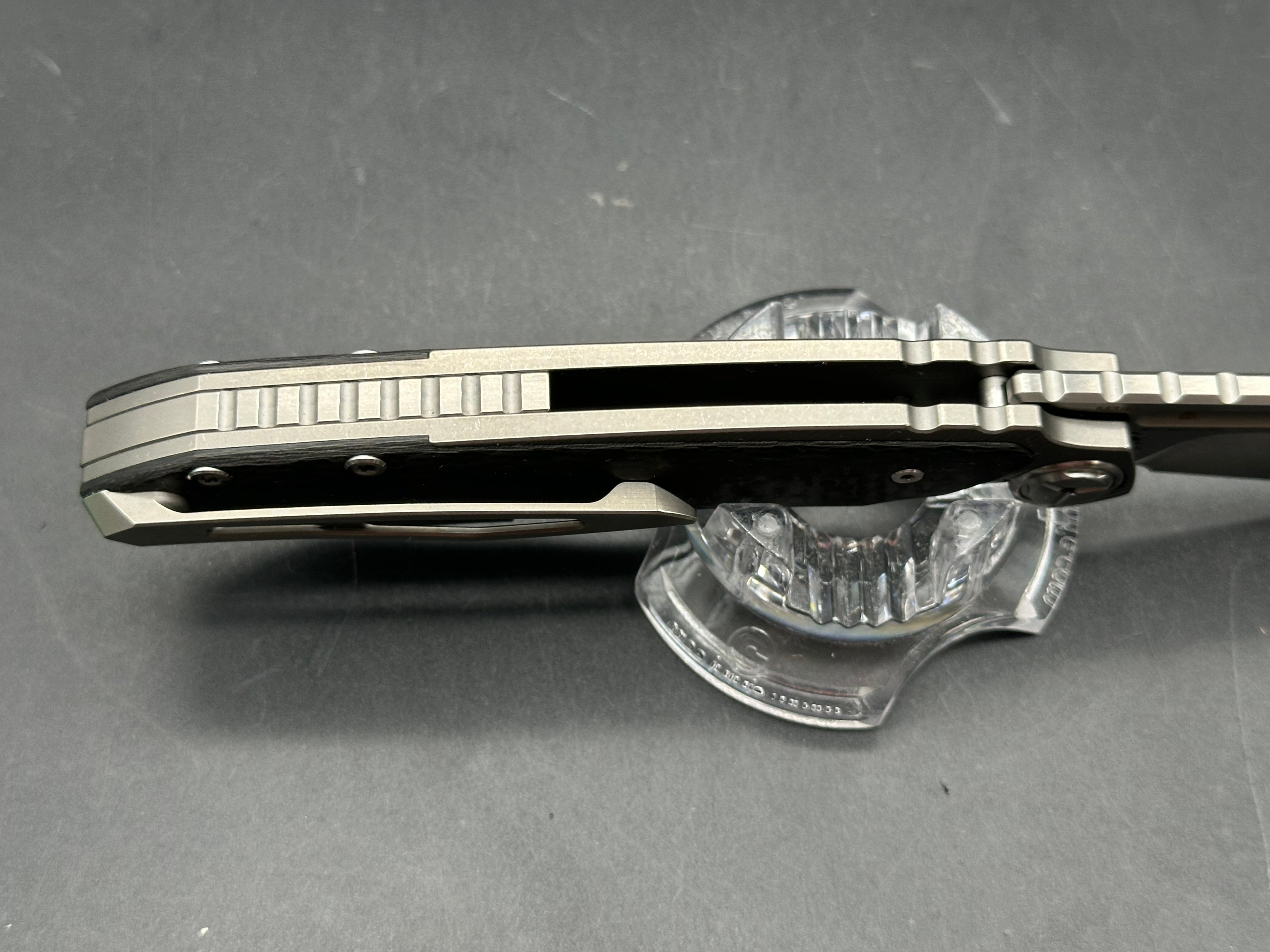 TwoSun TS229 Jelly Jerry design. 3.3 inch Bohler M390 blade. Frame lock. Titanium and carbon fiber handle