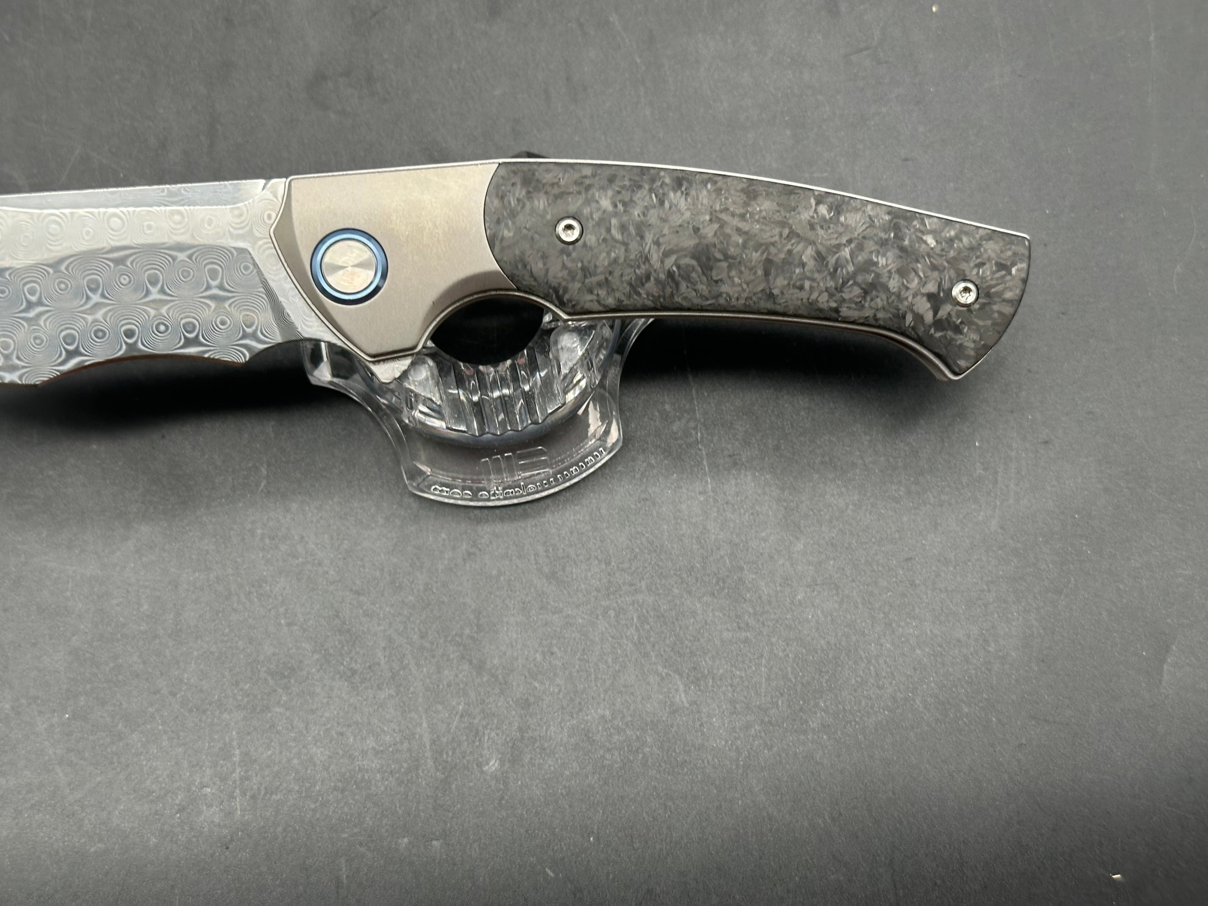 Sitivian ST255 / 3.5 inch polished Damascus blade. Titanium handle with carbon fiber inlays