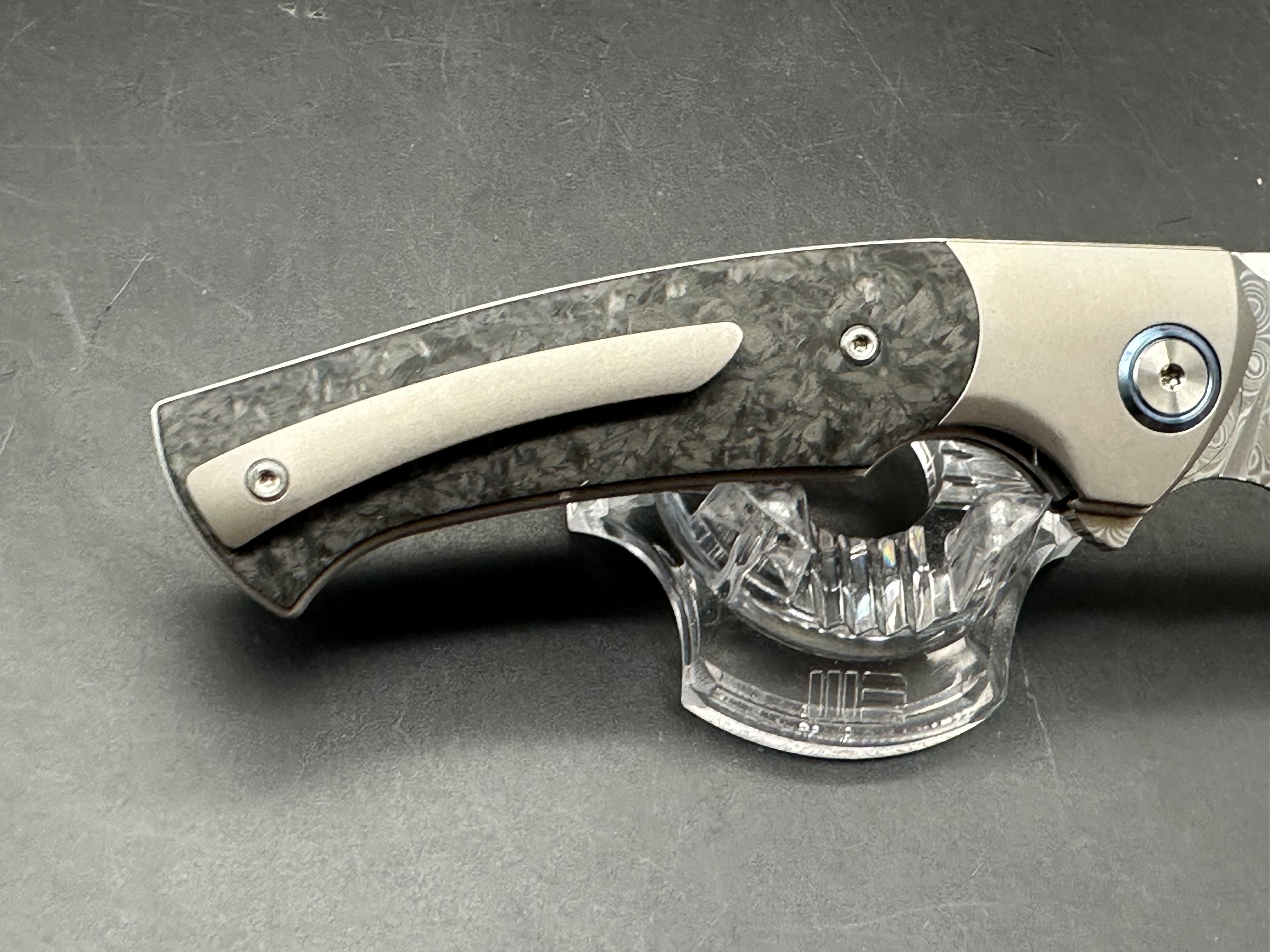 Sitivian ST255 / 3.5 inch polished Damascus blade. Titanium handle with carbon fiber inlays