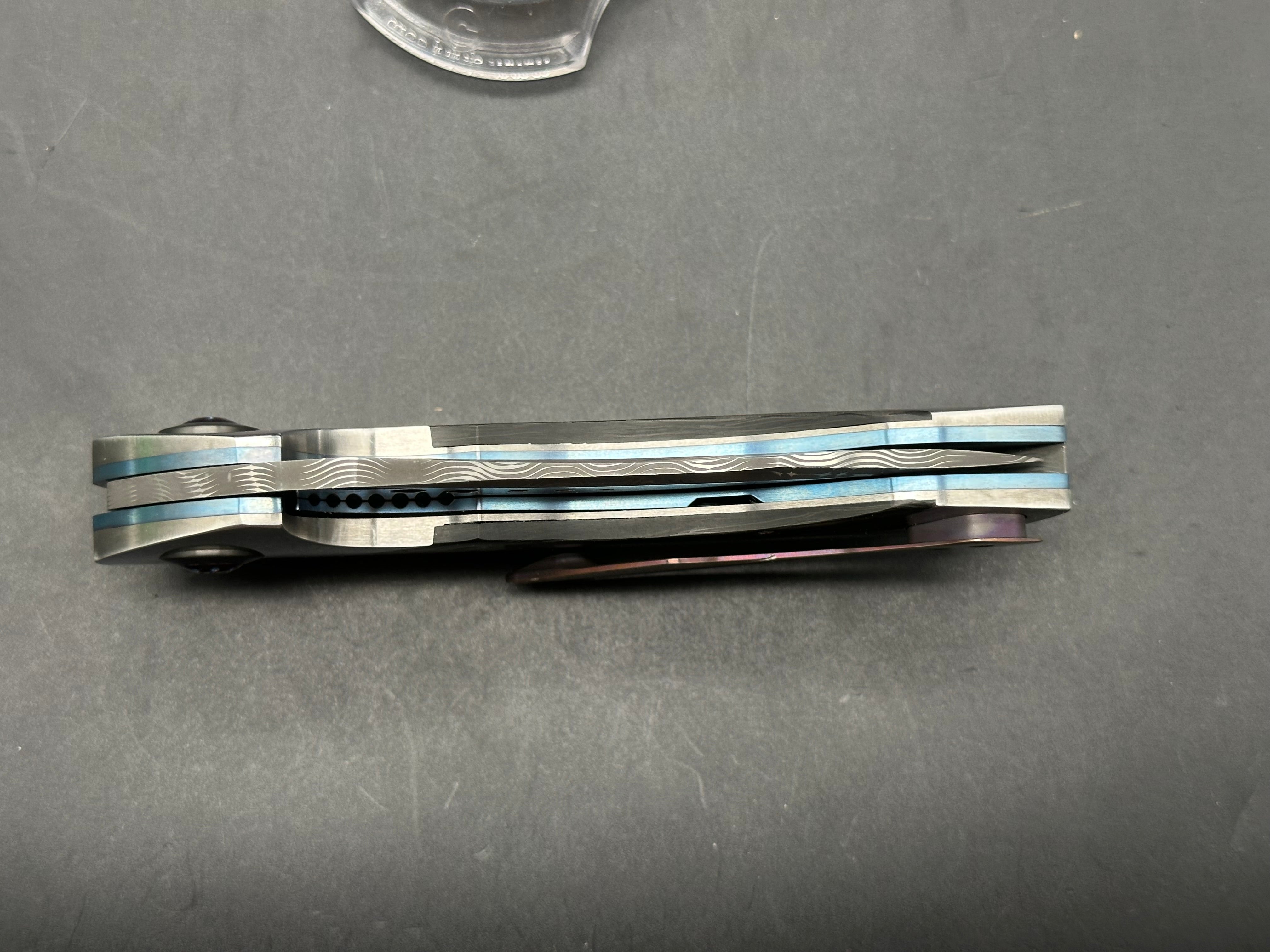 JD Vandeventer Sympatico: 3.75 inch Damascus blade with mirror polished flats. Handle with mirror polished titanium scales