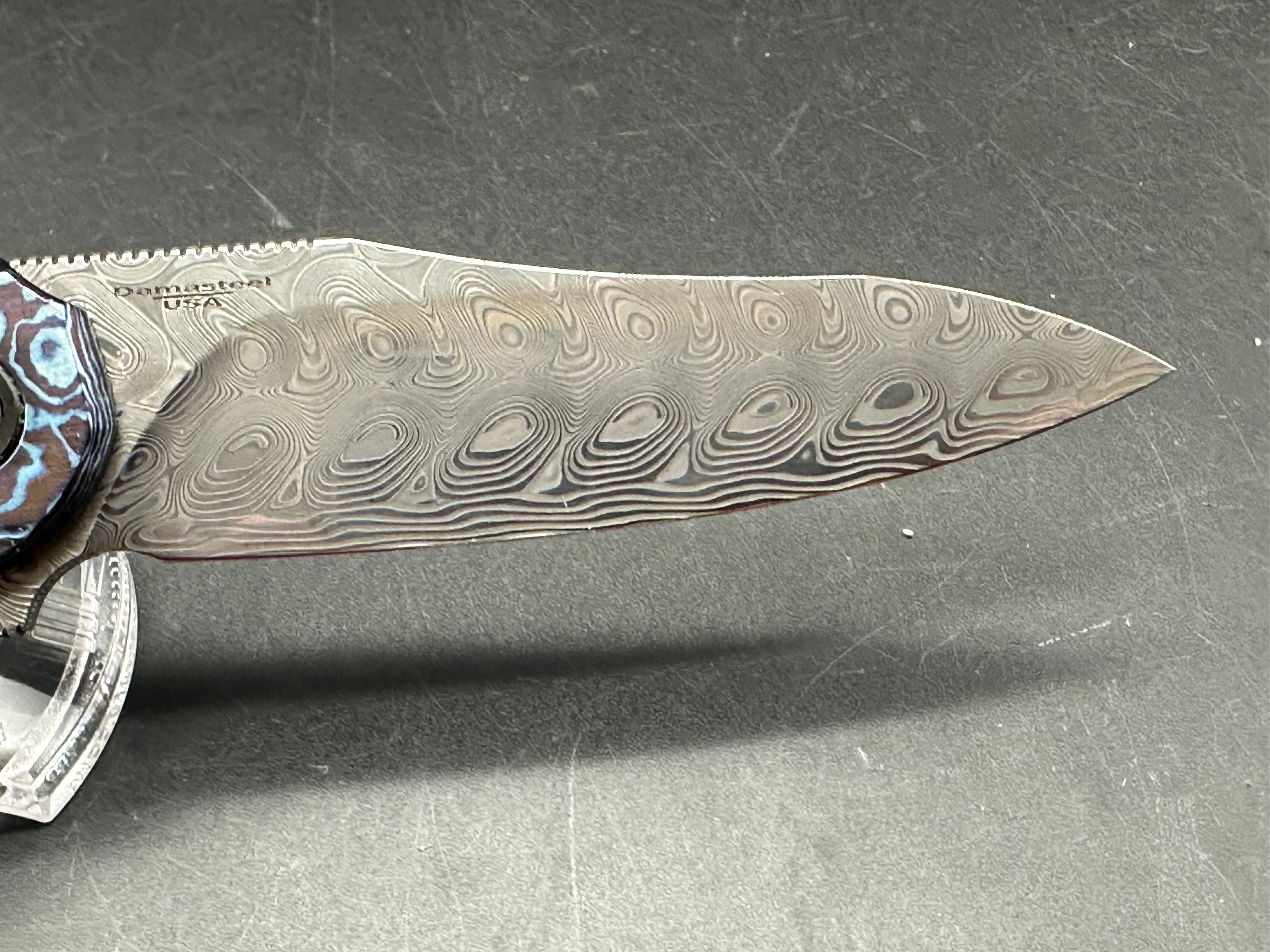 Brad Southard Mini Tolk Full Dress: 3.25 inch USA Damasteel blade. Mokuti scales with matching Mokuti backspacer and clip