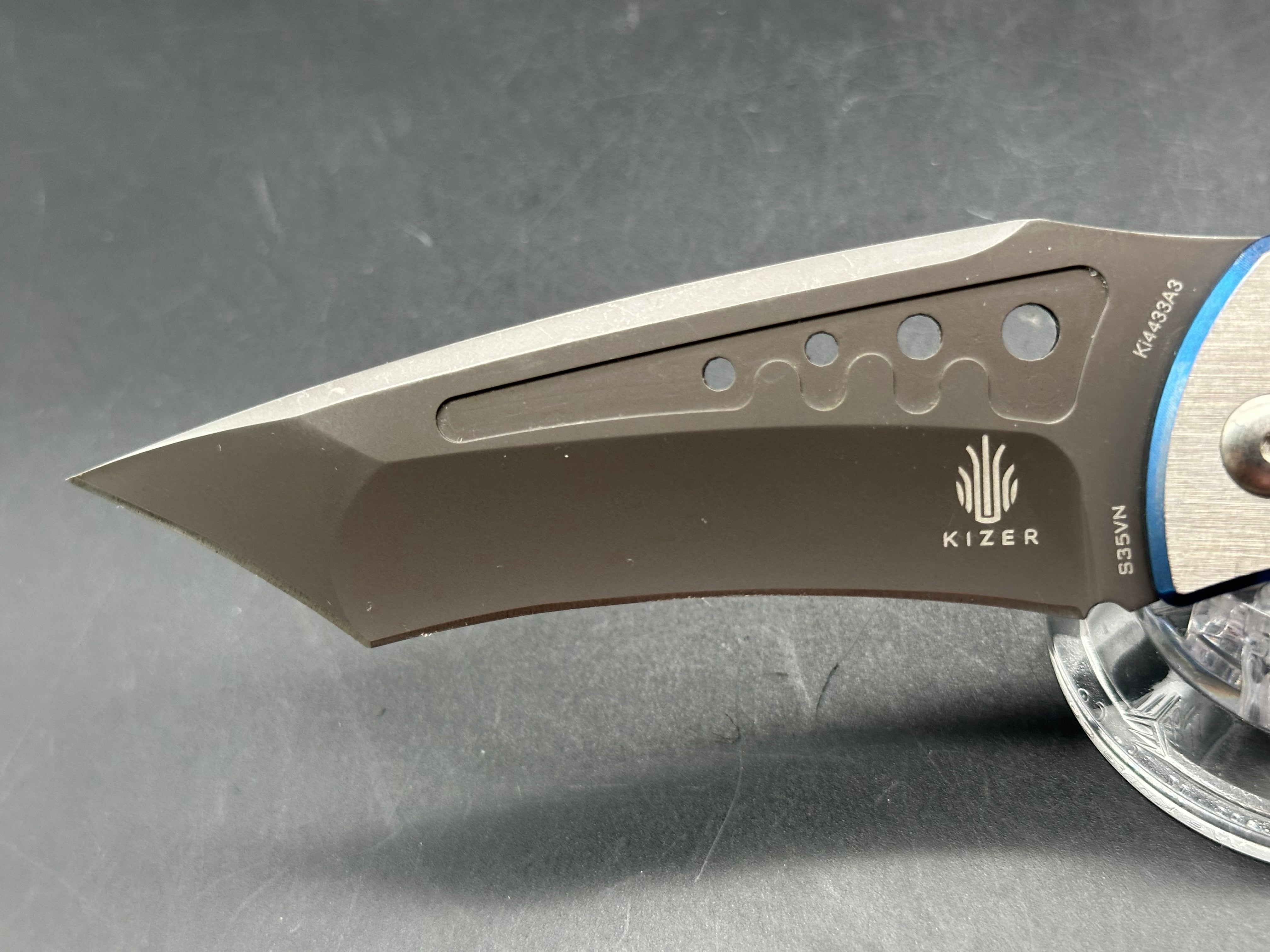 Kizer LGM: 4 inch titanium coated CPM-S35VN blade. Two tone anodized titanium frame