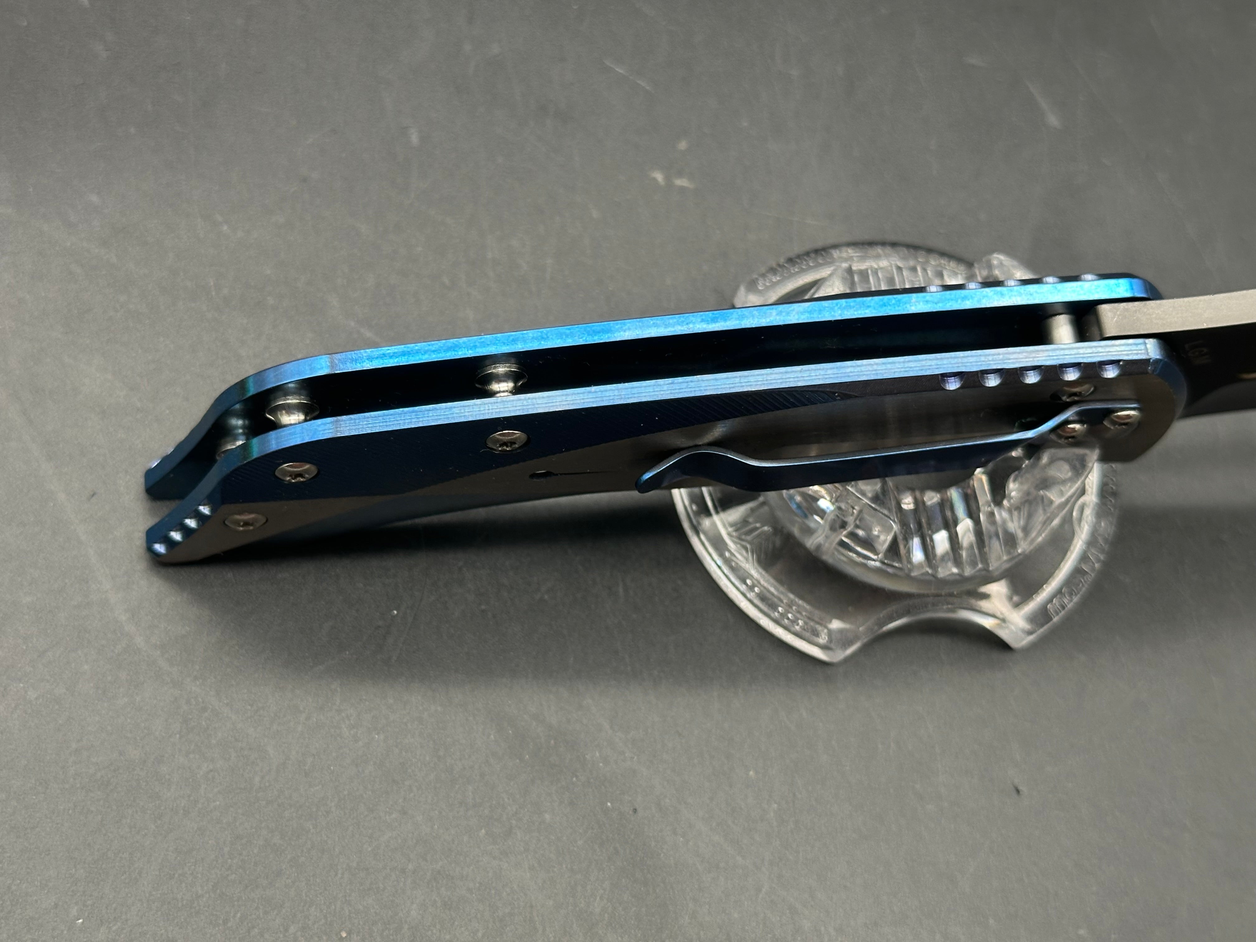 Kizer LGM: 4 inch titanium coated CPM-S35VN blade. Two tone anodized titanium frame