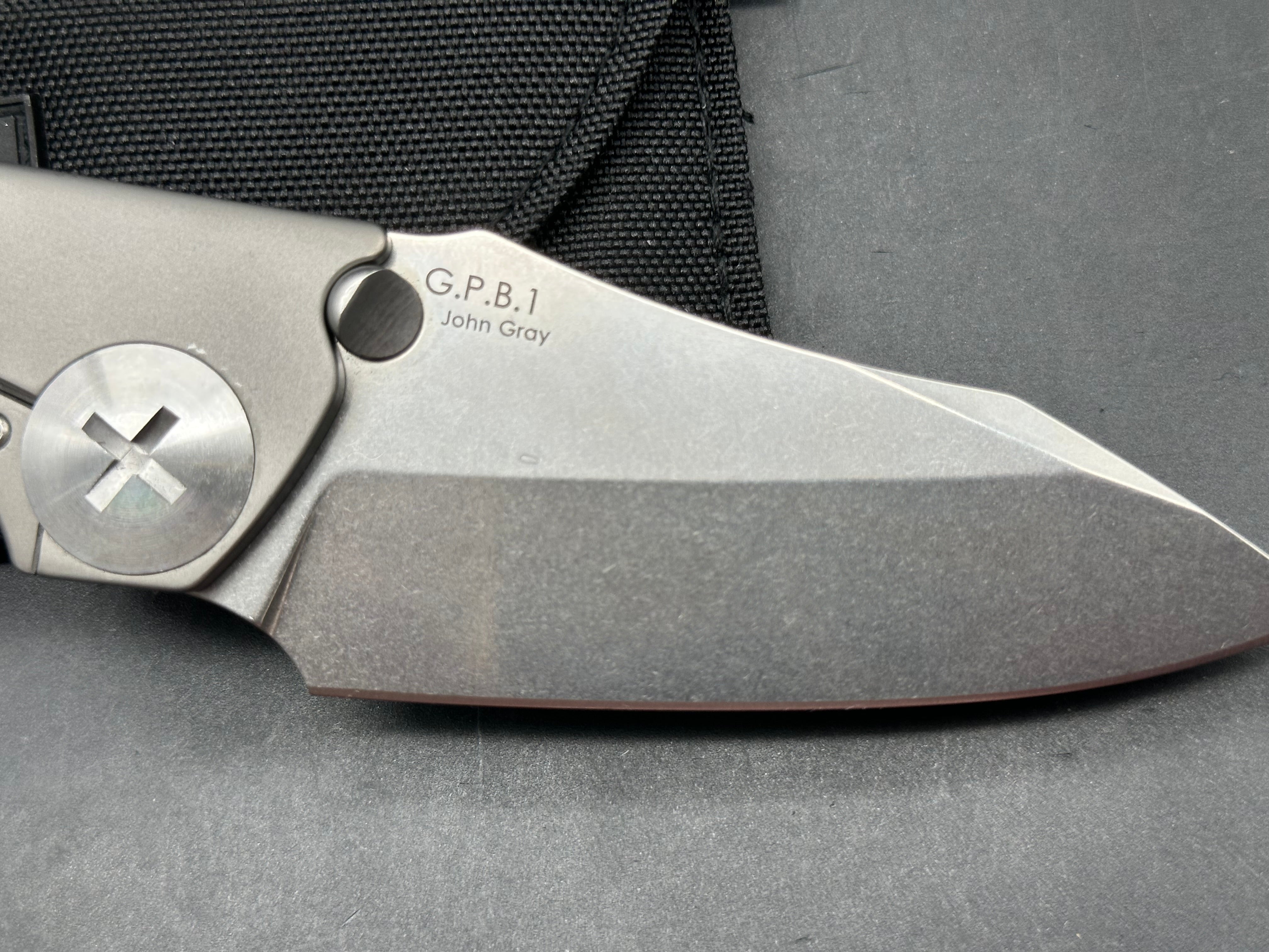 Kizer GPB1  / 3.625 inch tumbled finish CPM-S35VN blade. Bead blasted titanium frame with polished hardware