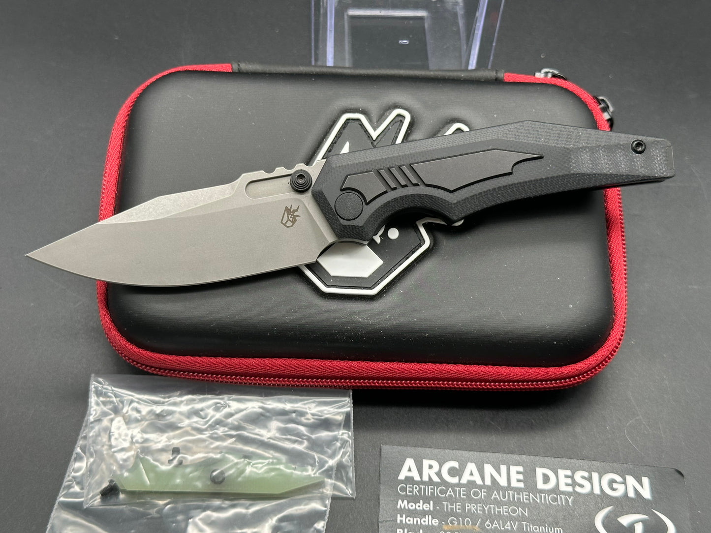 Arcane Preytheon black G10 handle w/titanium inserts w/extra jade G10 inserts included.