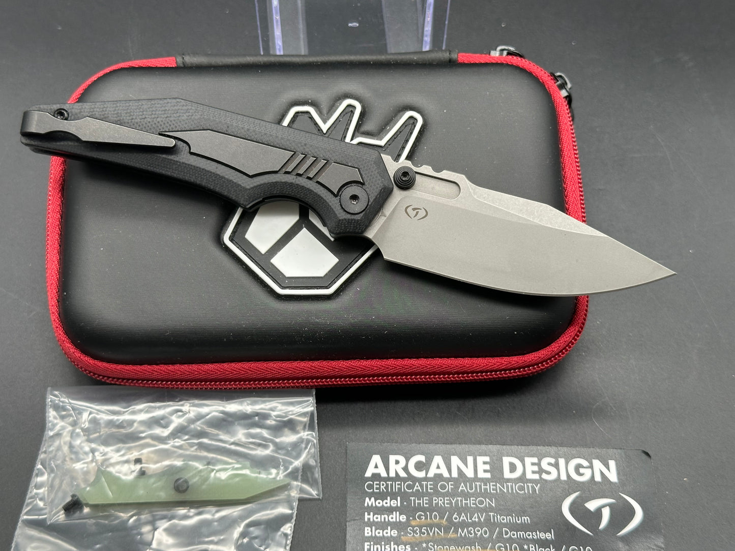 Arcane Preytheon black G10 handle w/titanium inserts w/extra jade G10 inserts included.