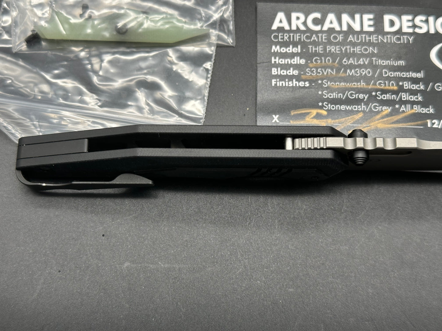 Arcane Preytheon black G10 handle w/titanium inserts w/extra jade G10 inserts included.